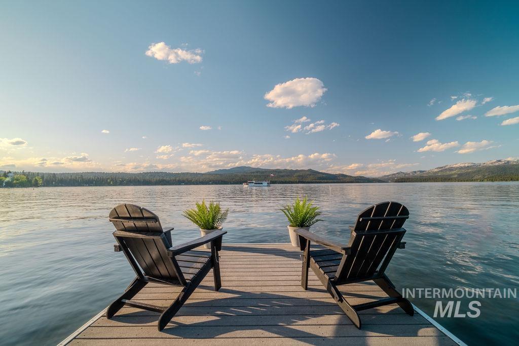 Waterfront dock featuring durable composite decking, direct water access, and expansive water frontage