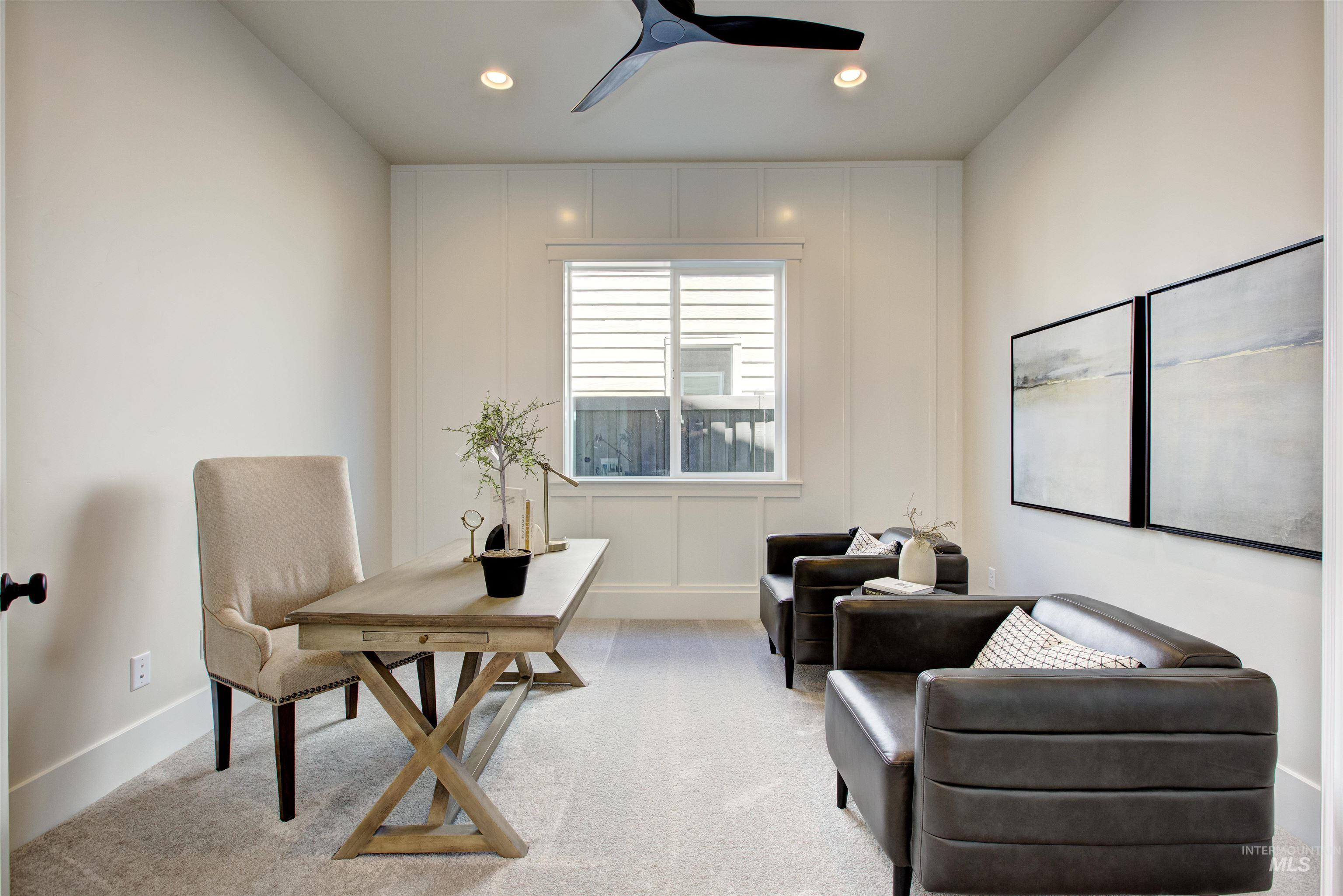 Home office with a decorative wall, carpet, ceiling fan, and recessed lighting
