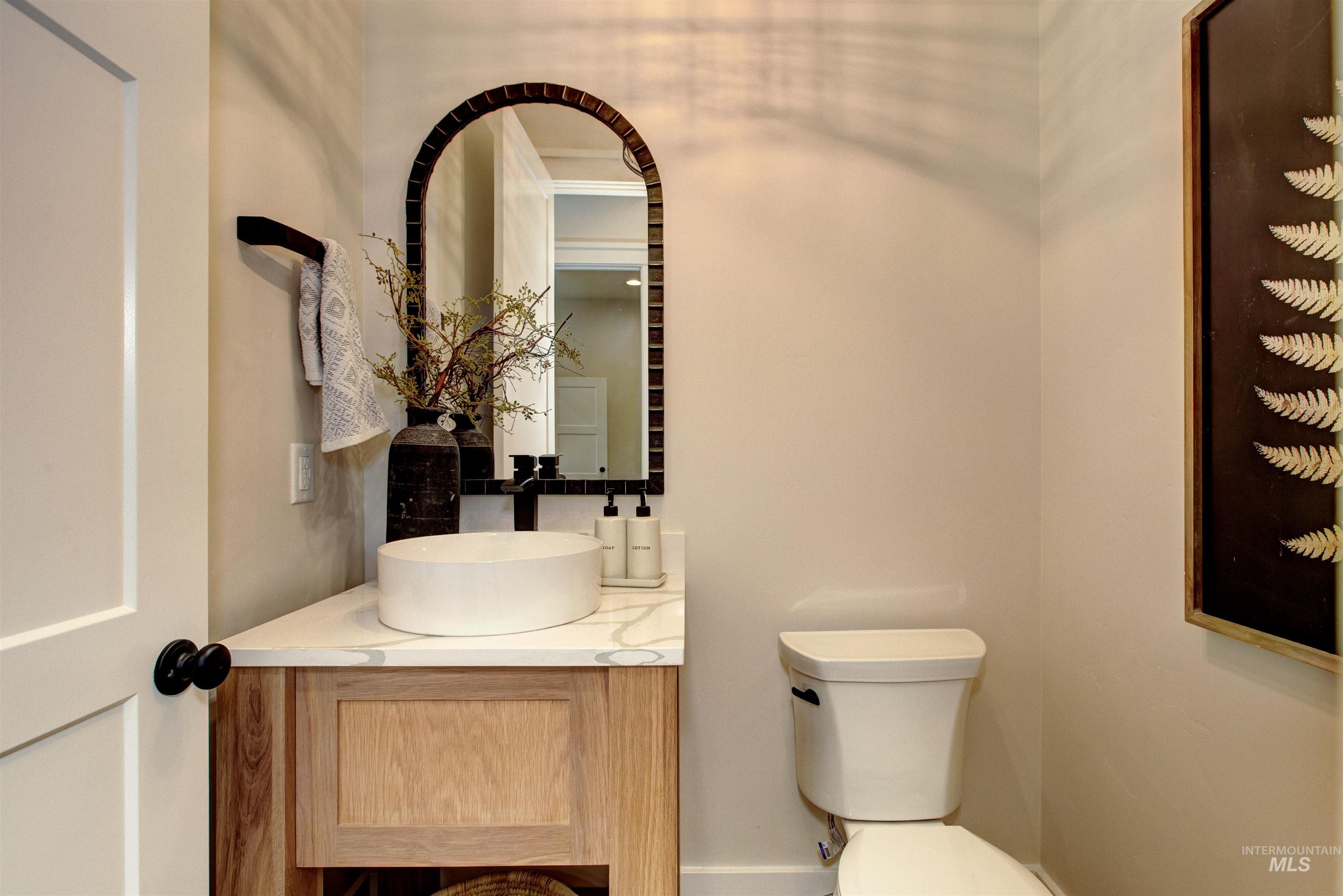 Half bath with vanity and toilet