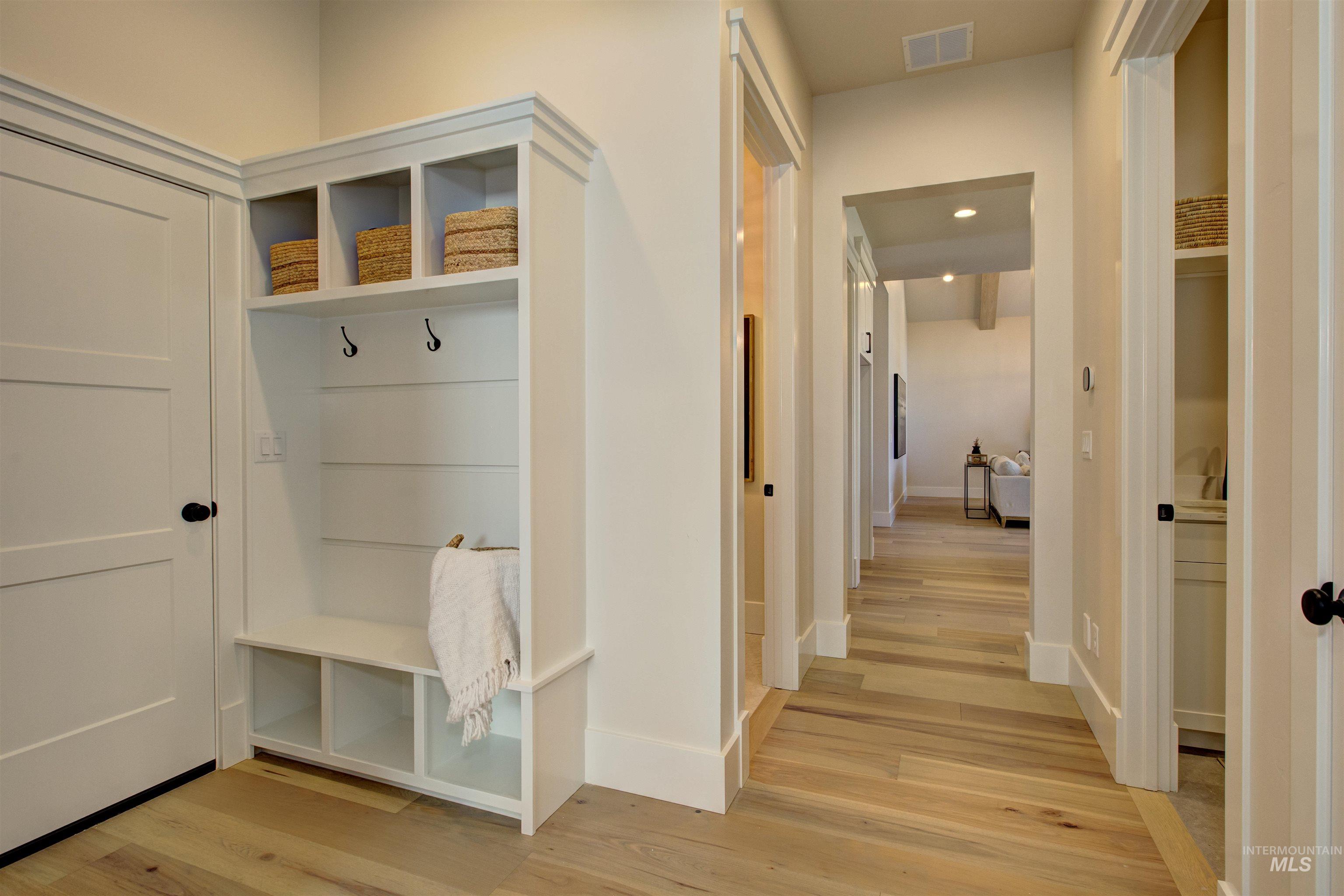 Mudroom with light wood-style flooring