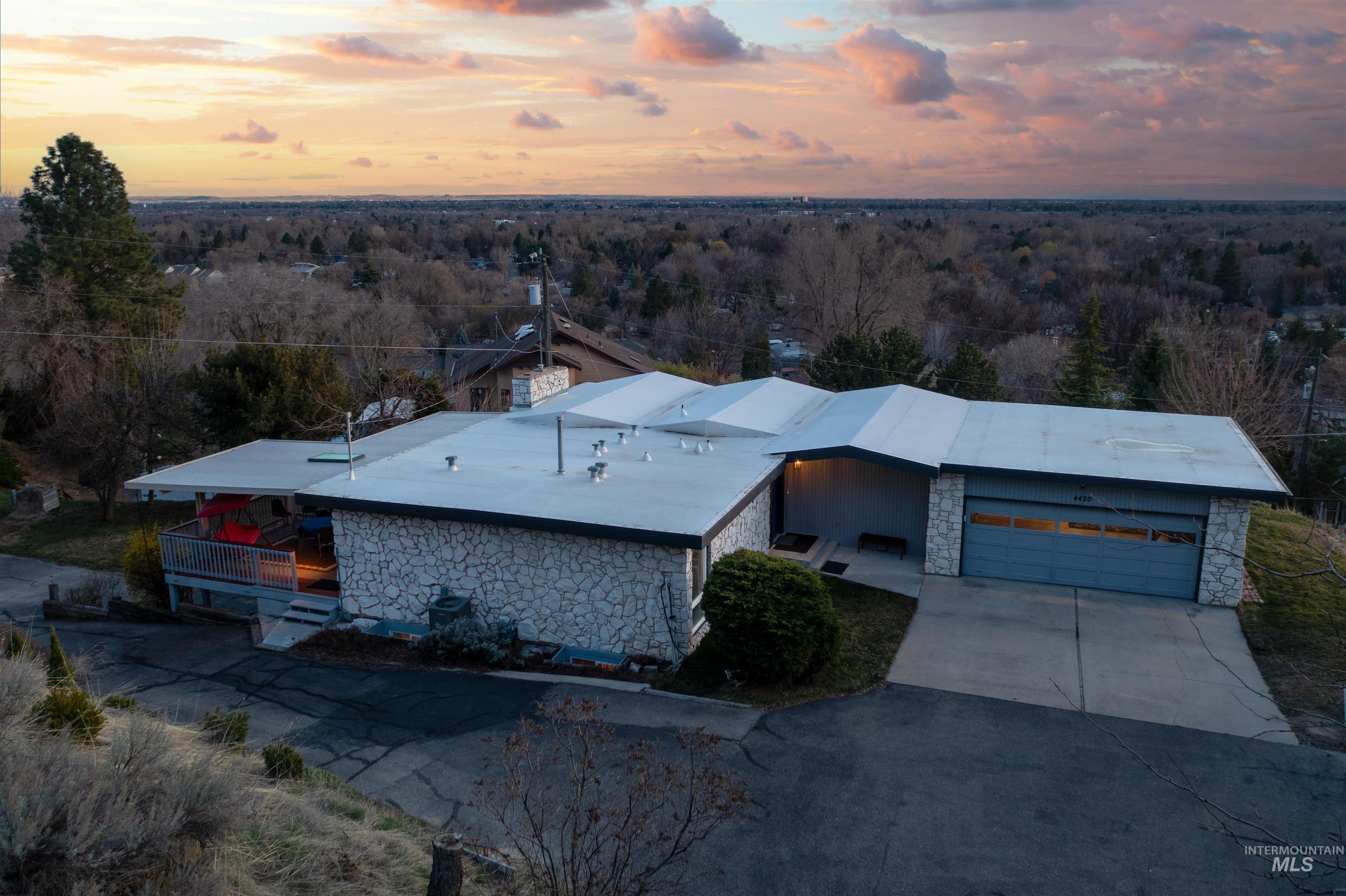 Aerial view at dusk of a wooded view