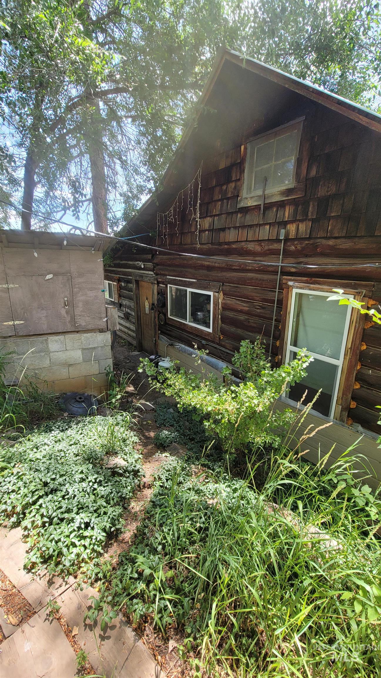 View of property exterior with log siding