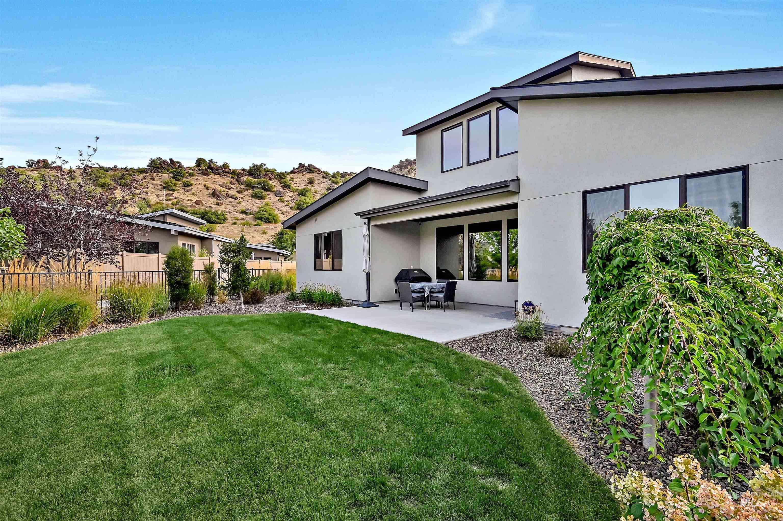 Back of house featuring a patio area and stucco siding