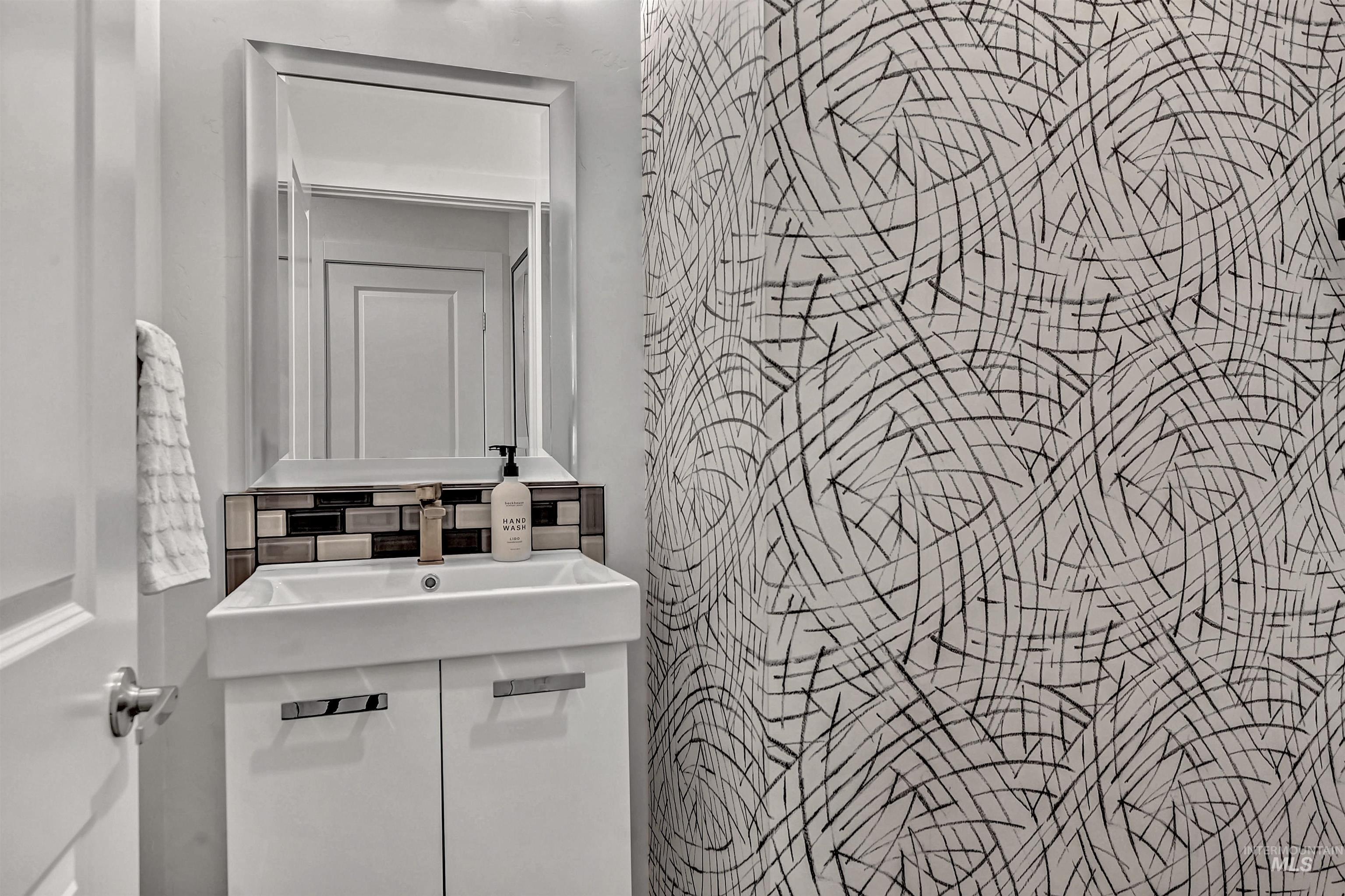 Half bathroom with a sink