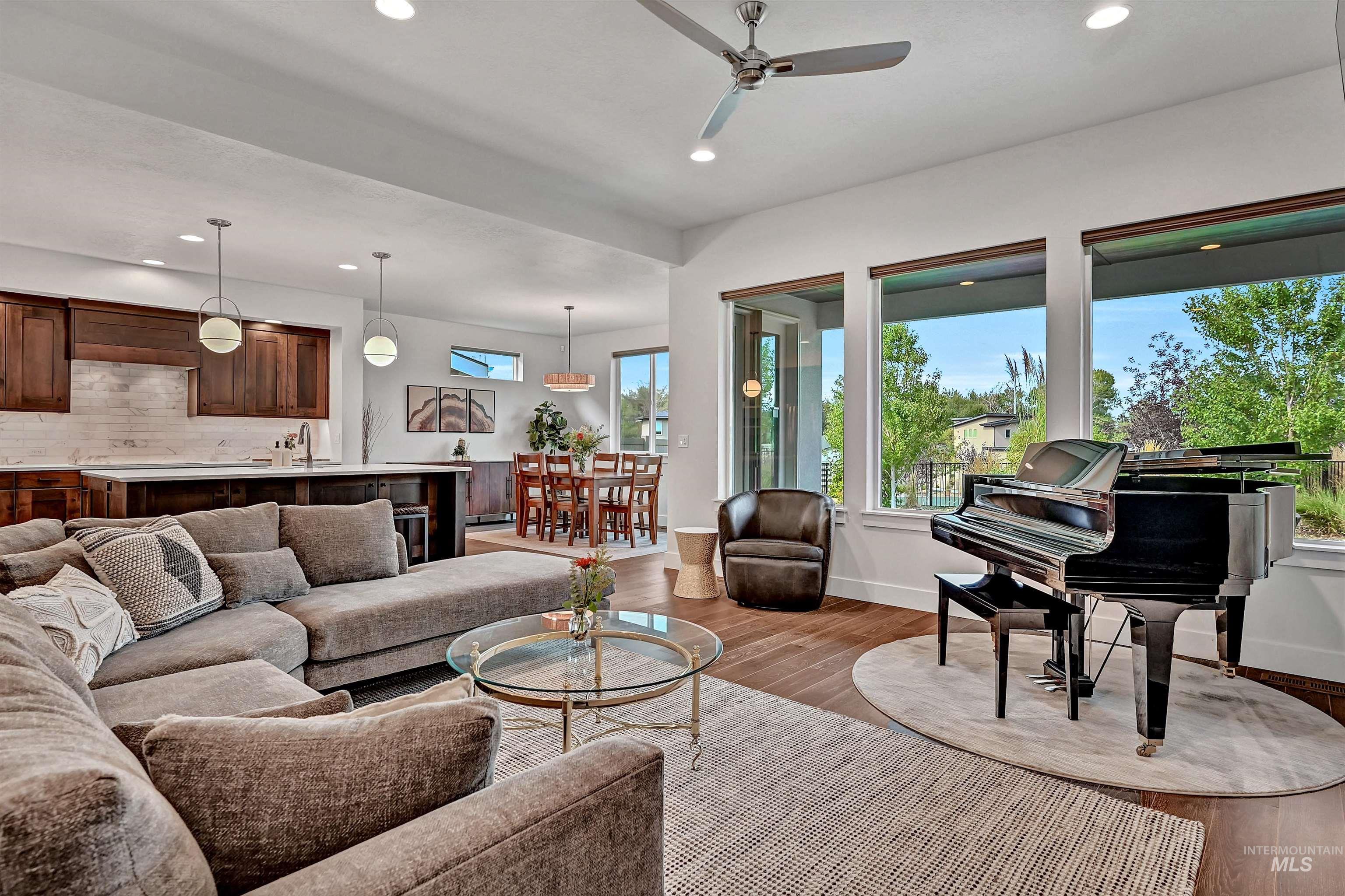 Living room featuring wood finished floors, recessed lighting, plenty of natural light, and ceiling fan