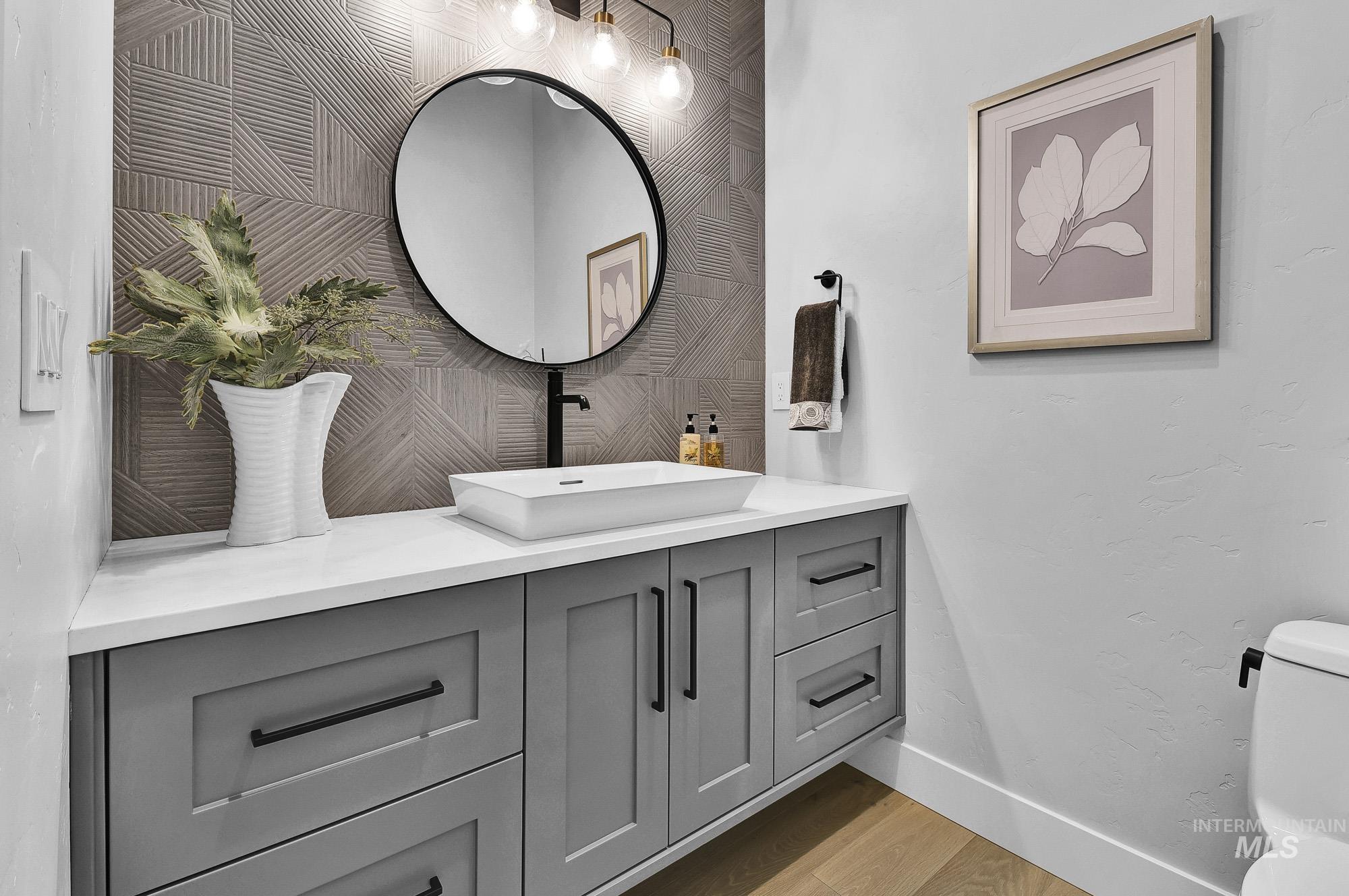 Bathroom with vanity and light wood-style flooring