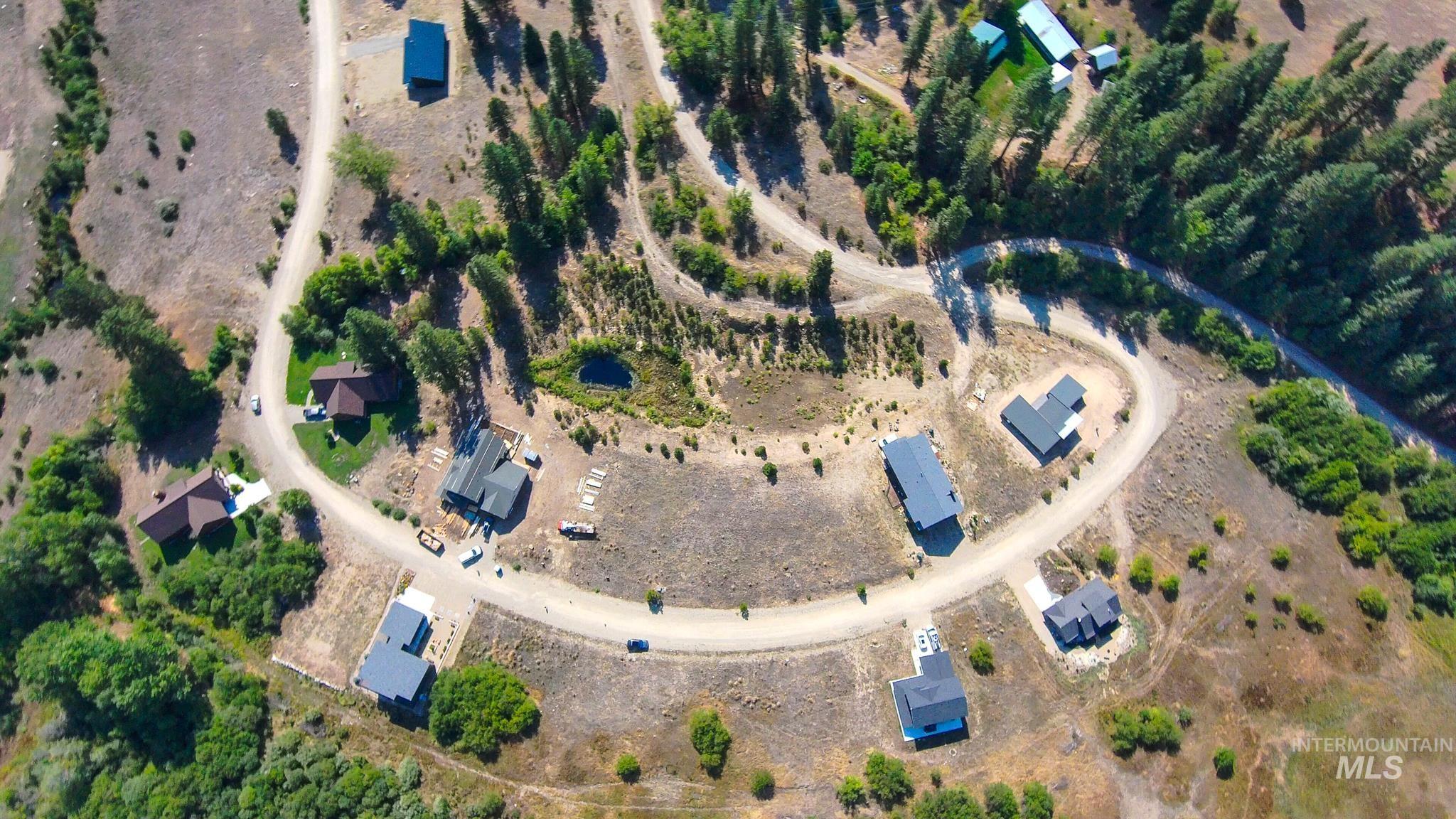 Aerial view of property and surrounding area with rural landscape