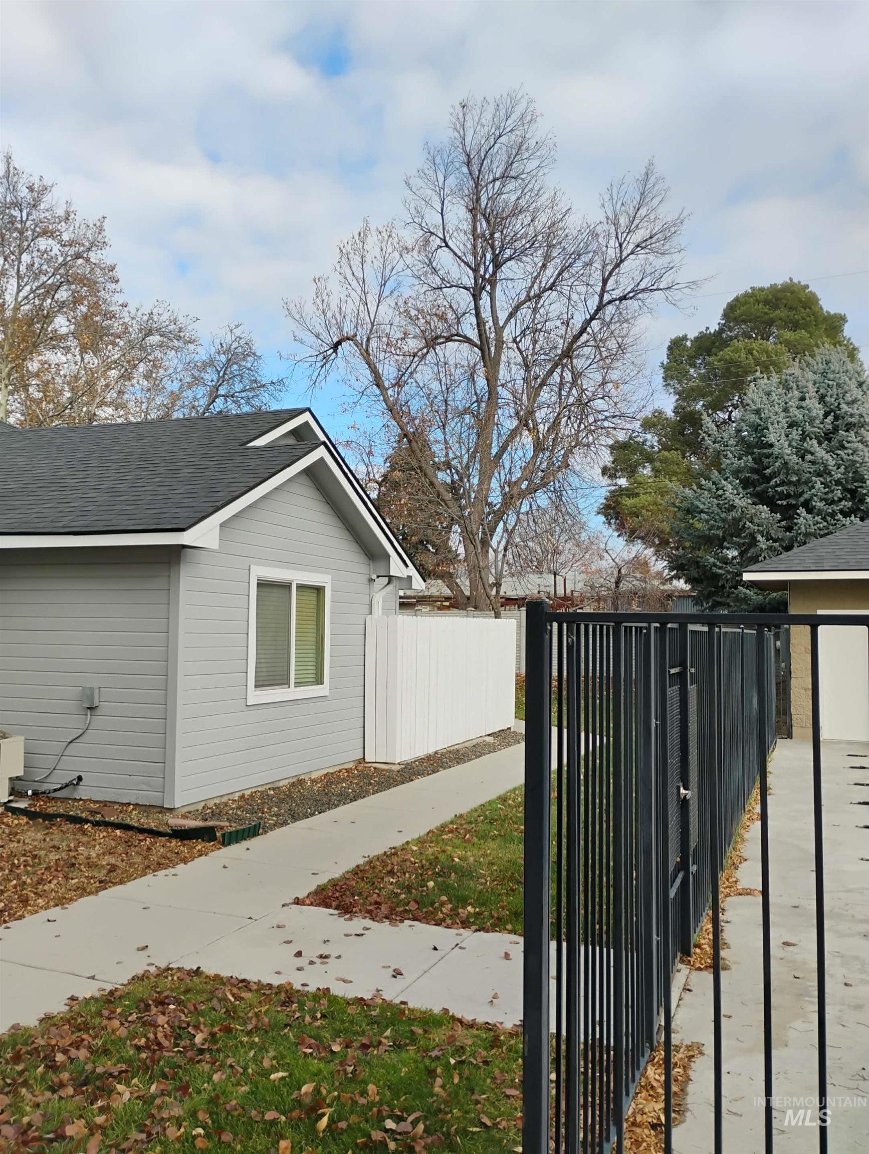 View of home's exterior featuring roof with shingles