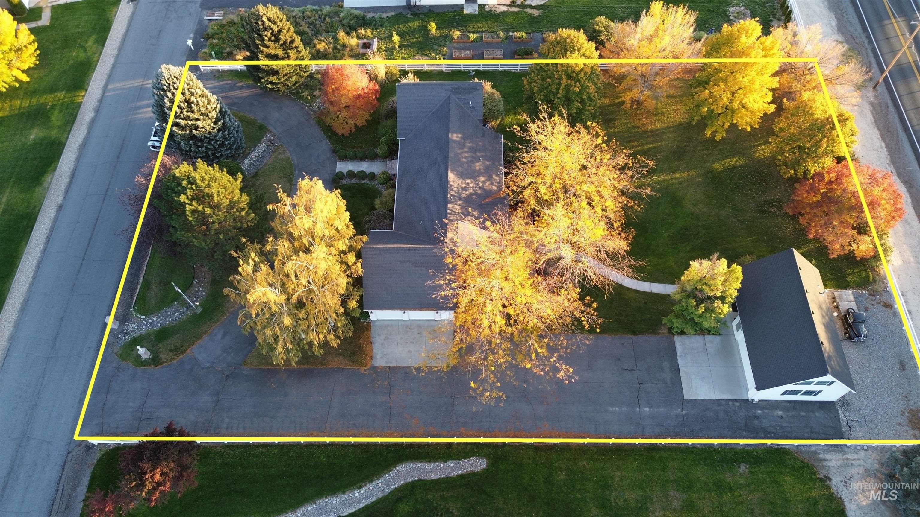 Aerial view of property and surrounding area with property boundaries highlighted