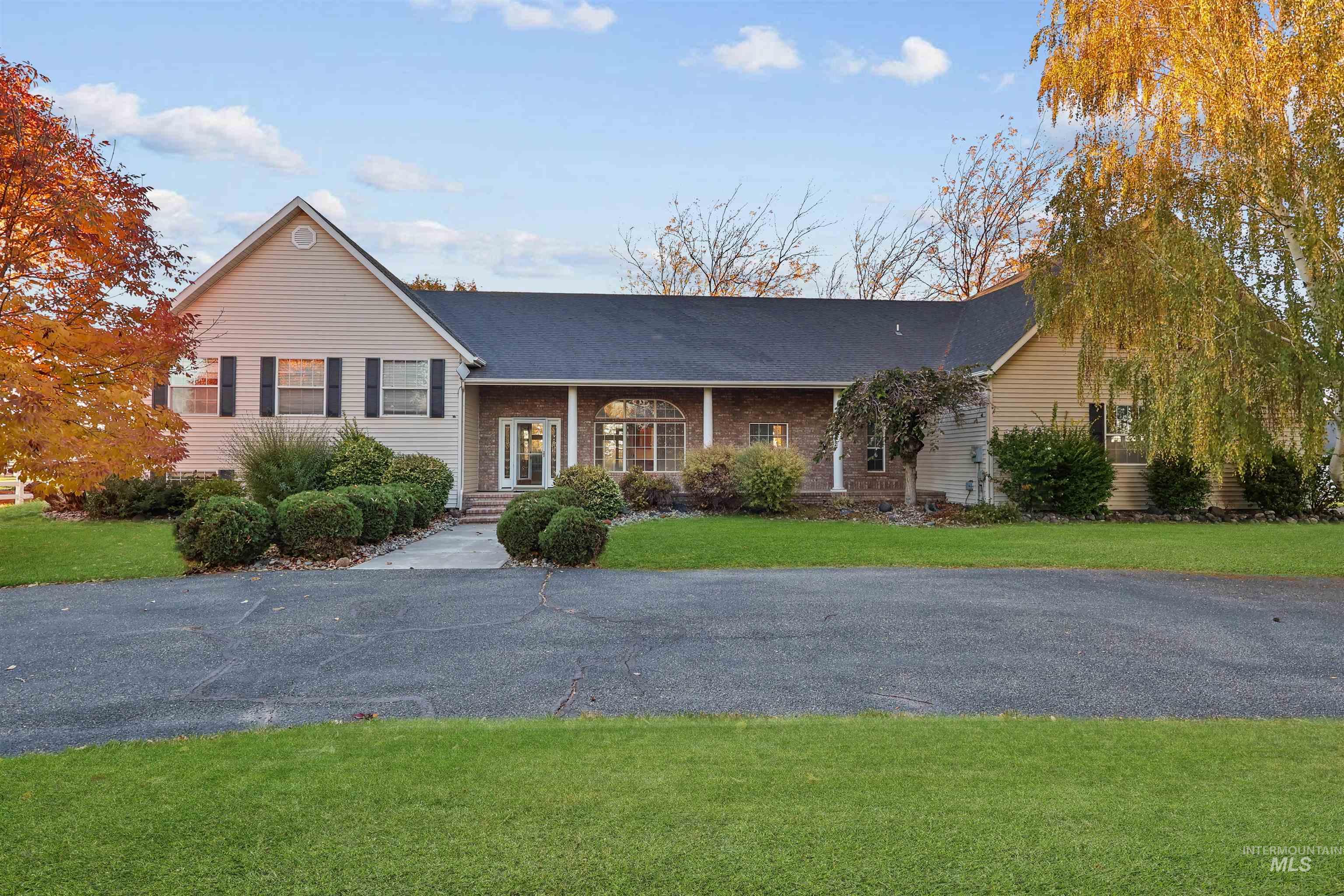 View of front of home featuring a porch and a front lawn