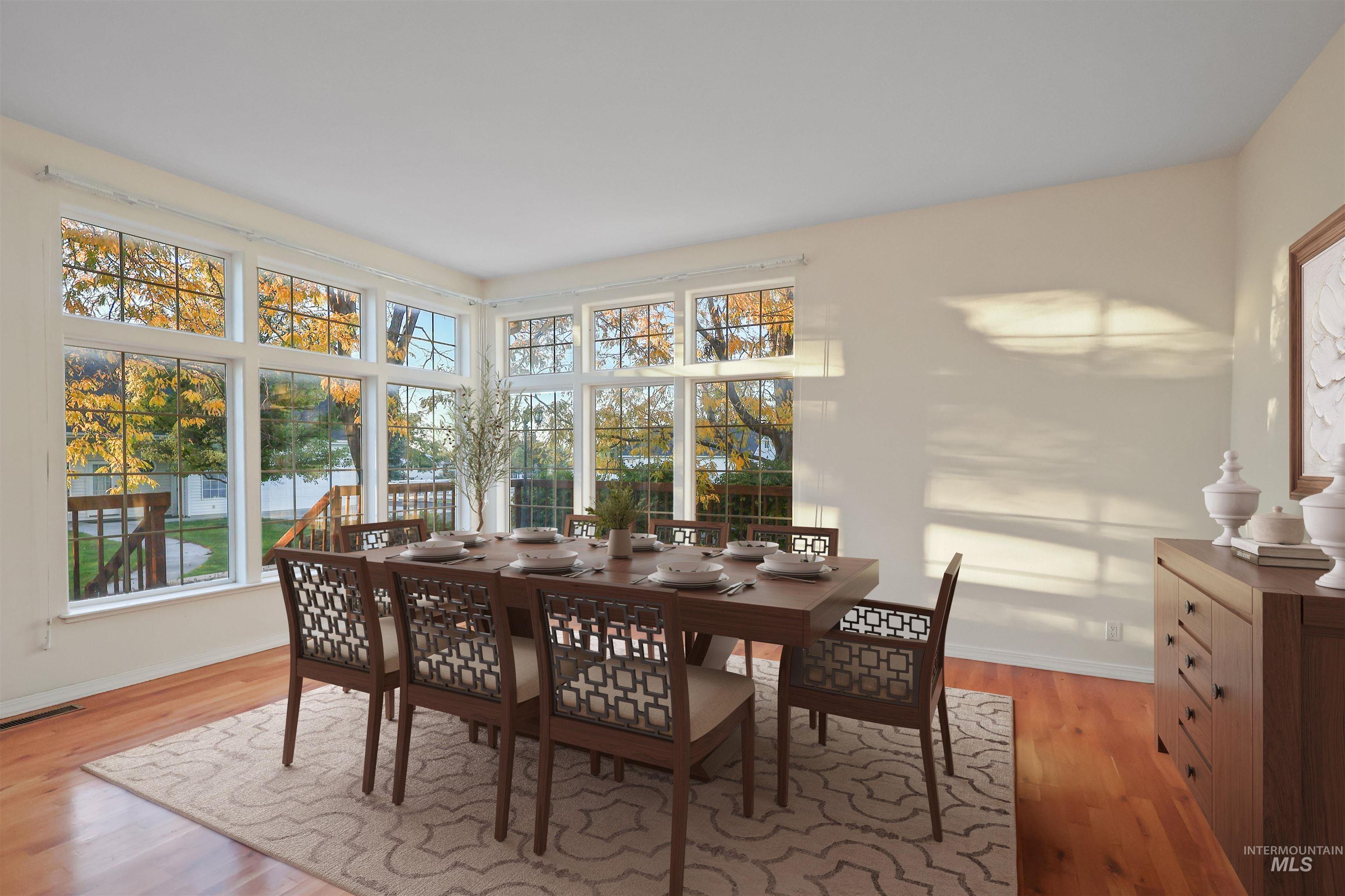 Dining room featuring baseboards and light wood finished floors