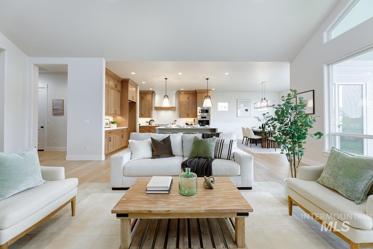 Living room featuring recessed lighting and light wood-style flooring