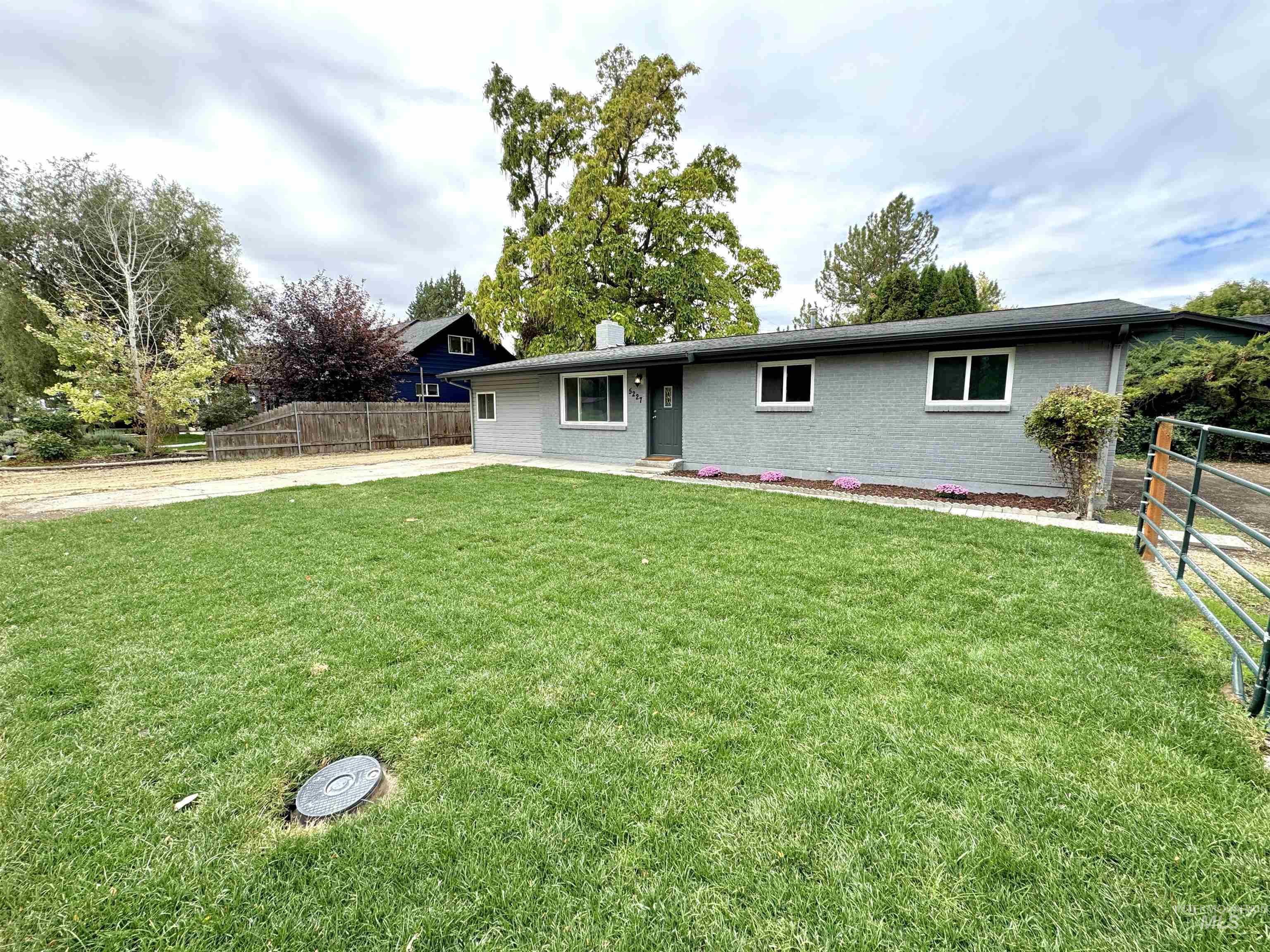 Ranch-style house with brick siding and a chimney