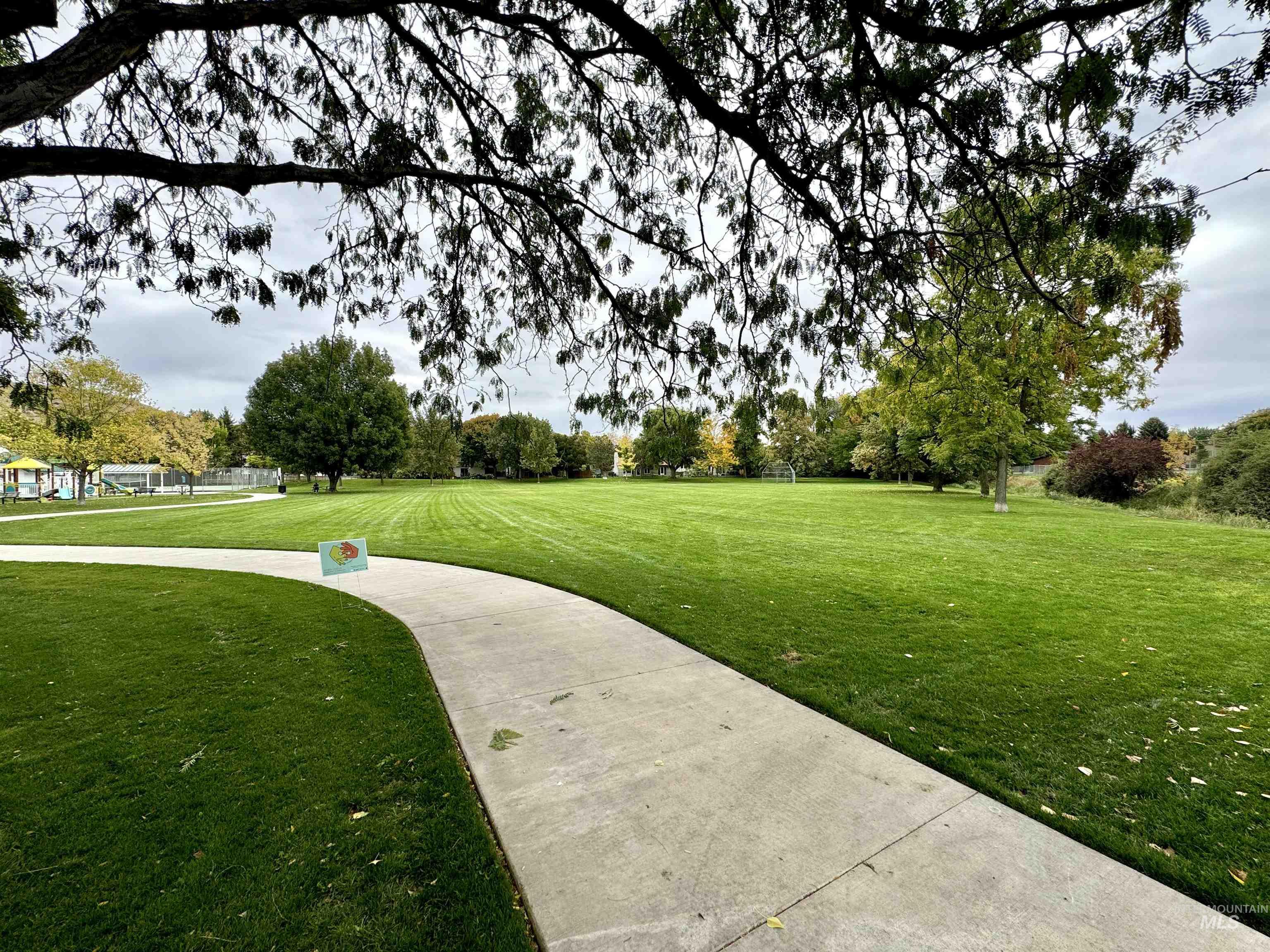 View of property's community featuring a lawn