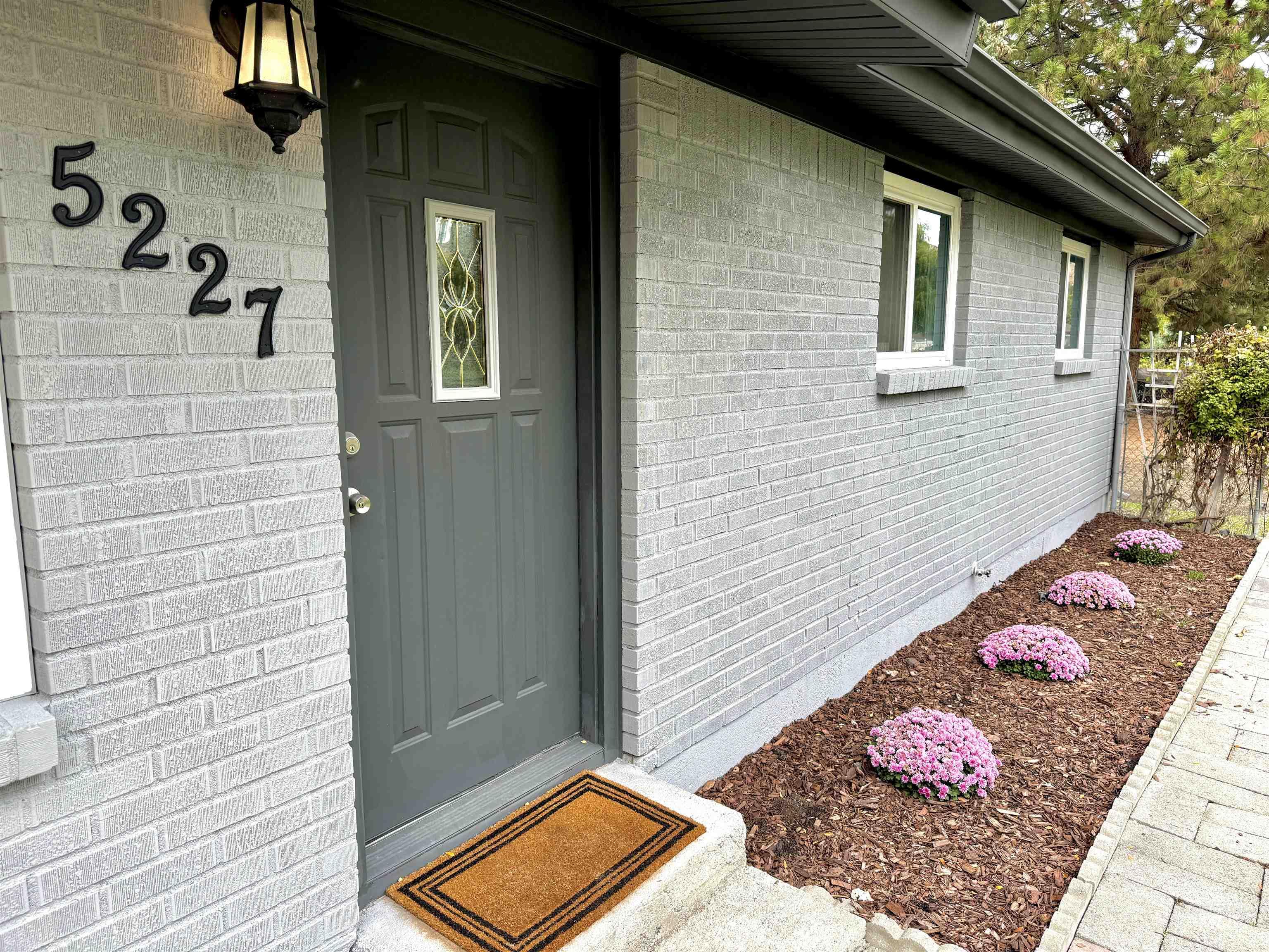 Doorway to property with brick siding