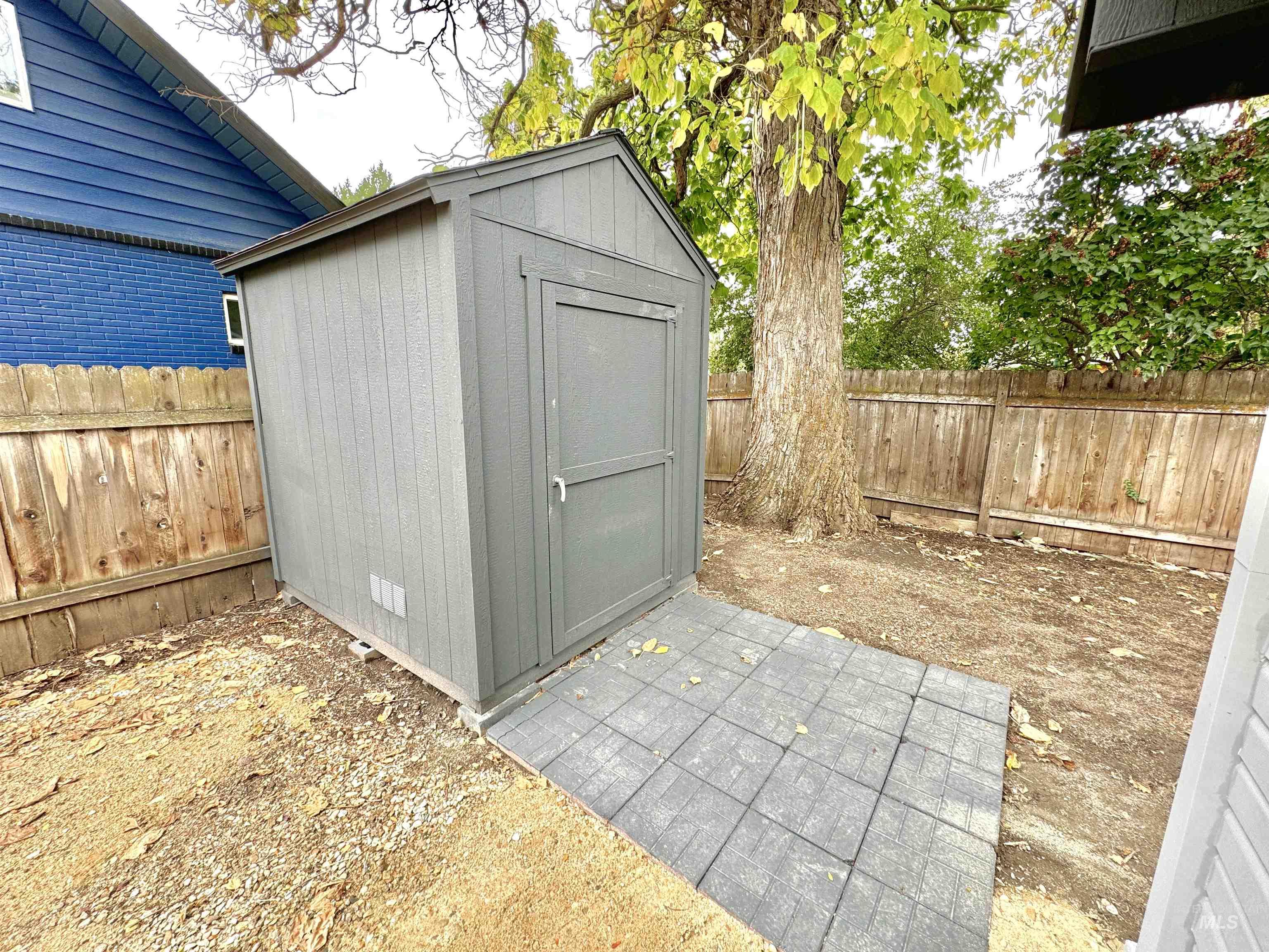 View of shed featuring a fenced backyard