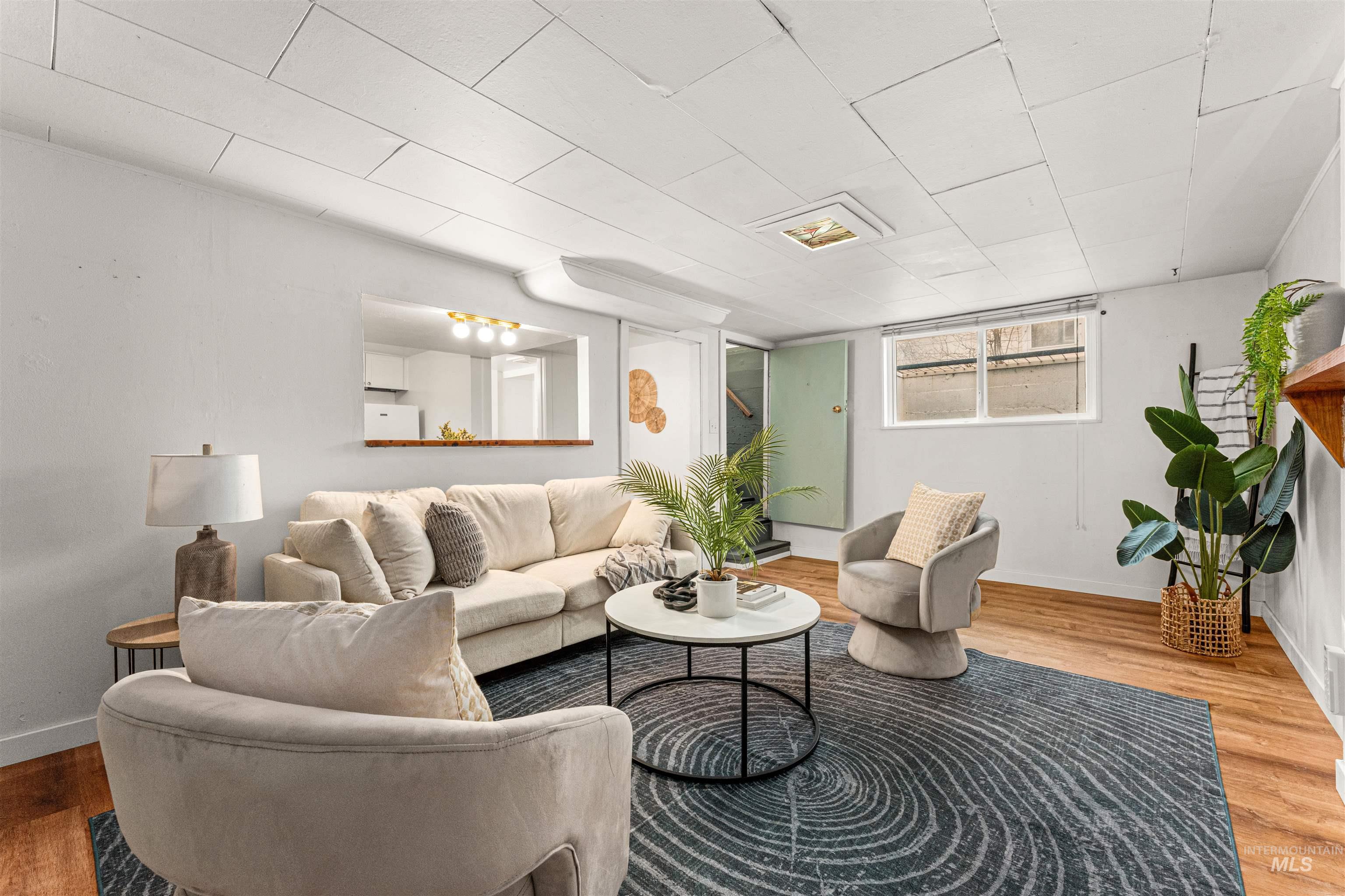 Living area with wood finished floors and built in features