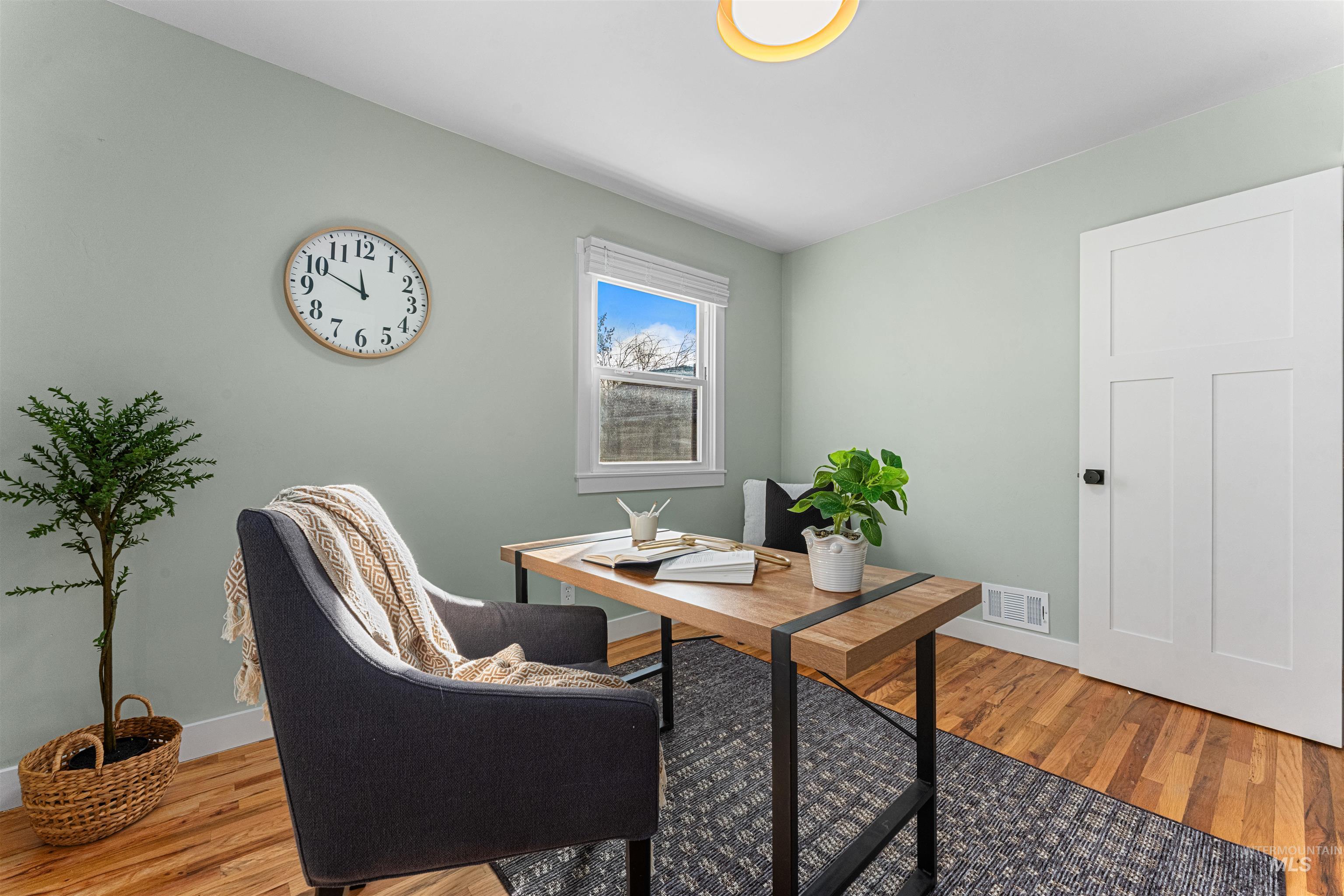 Kitchen featuring stainless steel appliances, glass fronted cabinets, light countertops, recessed lighting, and light marble finish flooring