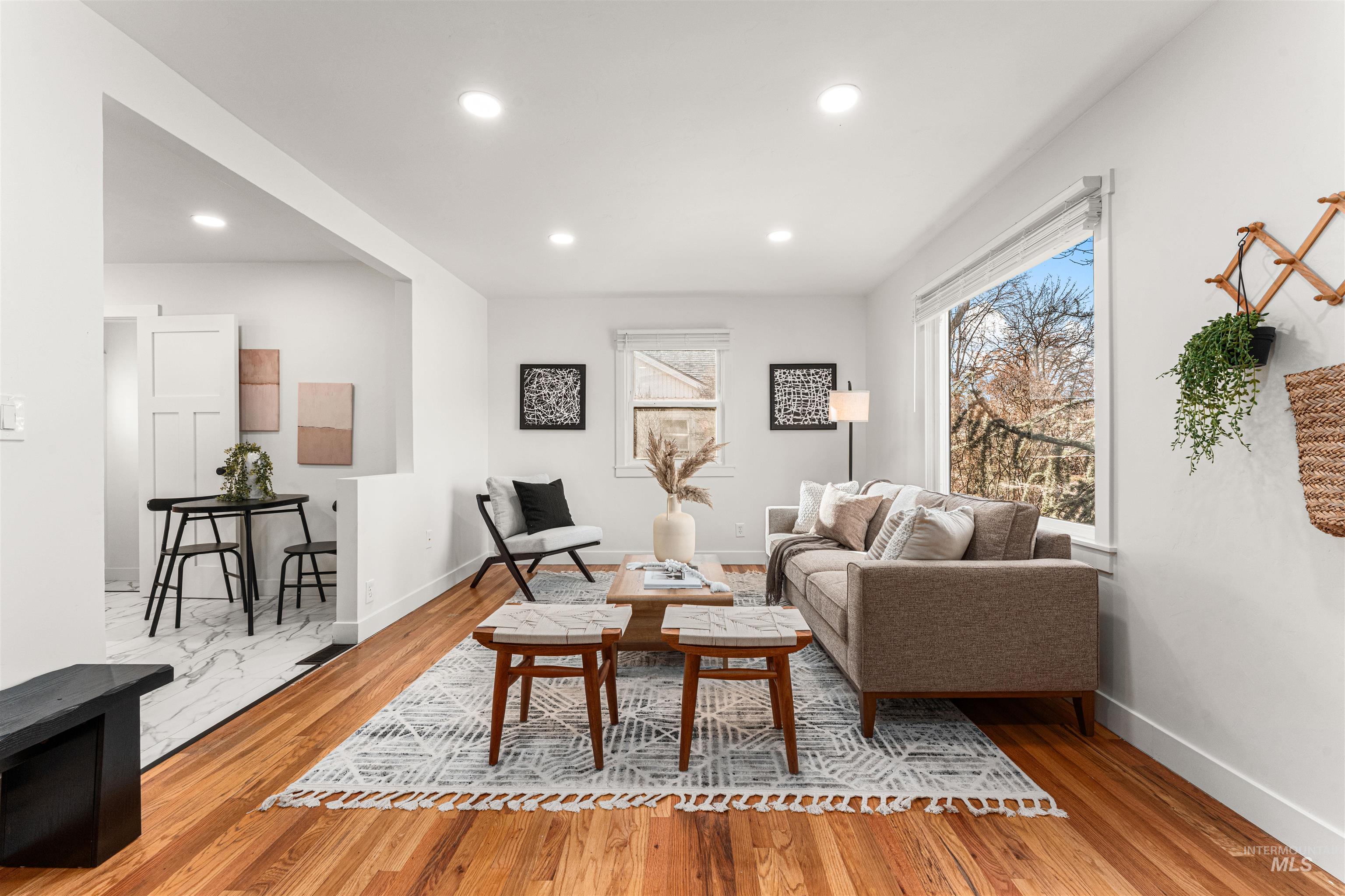 Living area featuring light wood-type flooring and recessed lighting