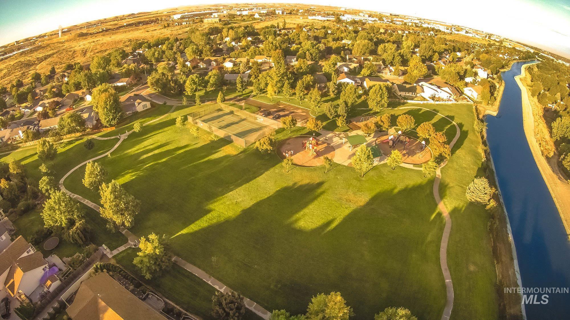 Aerial view of residential area featuring a large body of water