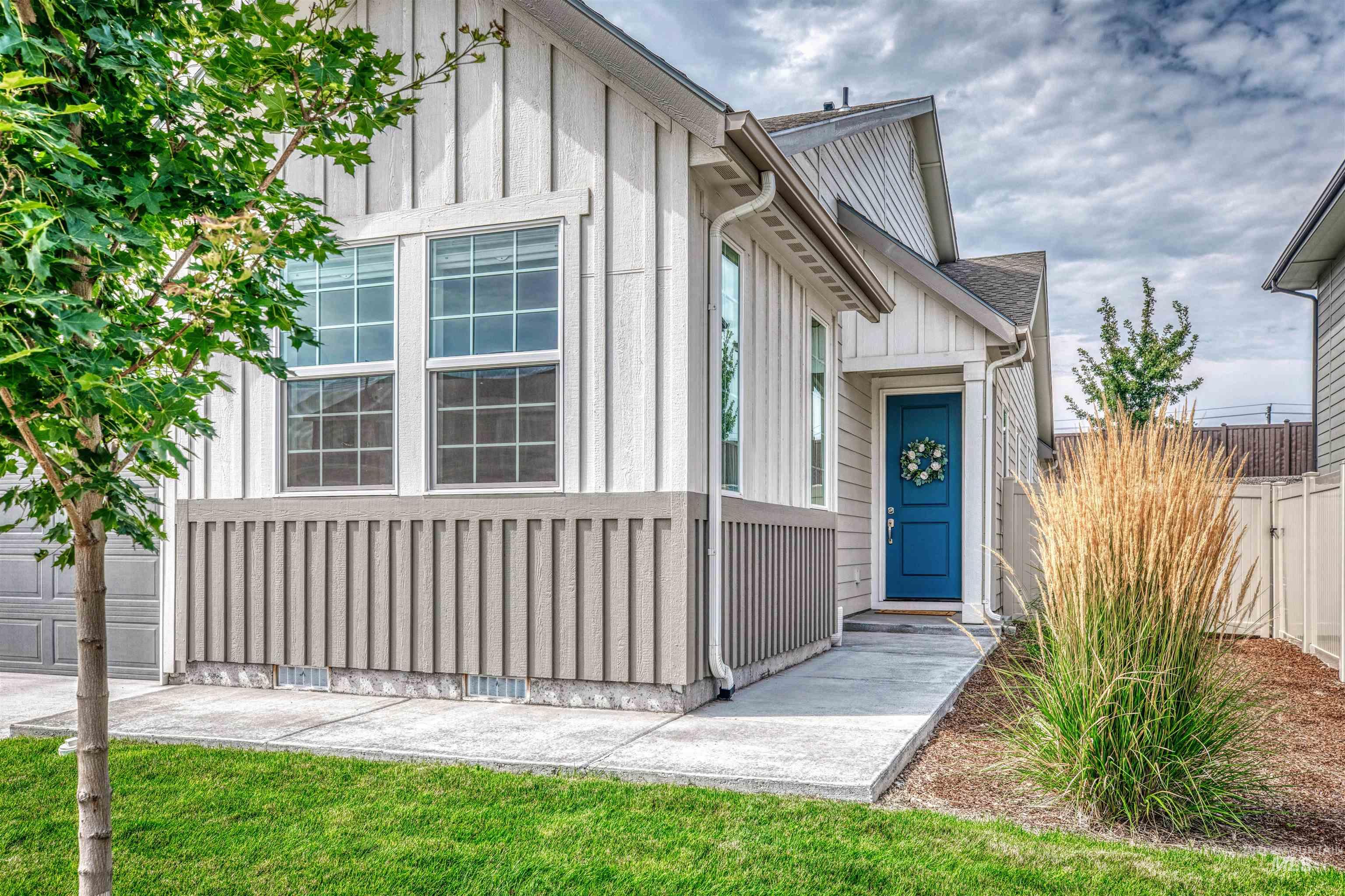 Entrance to property featuring board and batten siding