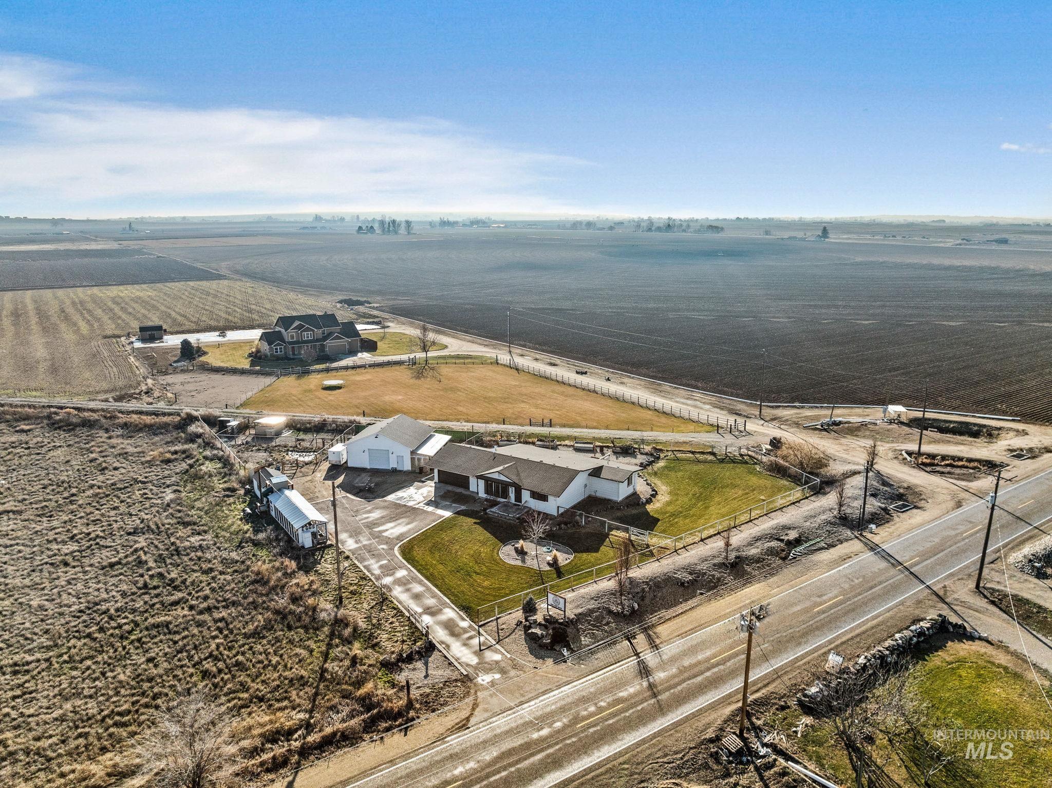 Aerial view of sparsely populated area with extensive farmland