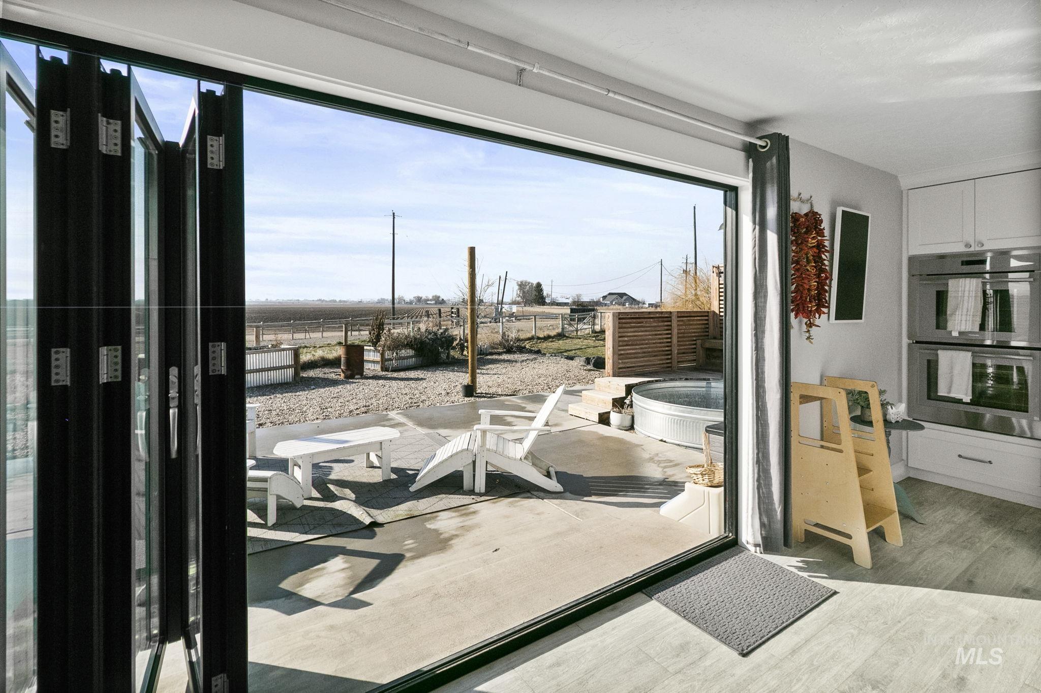Doorway to outside featuring wood finished floors