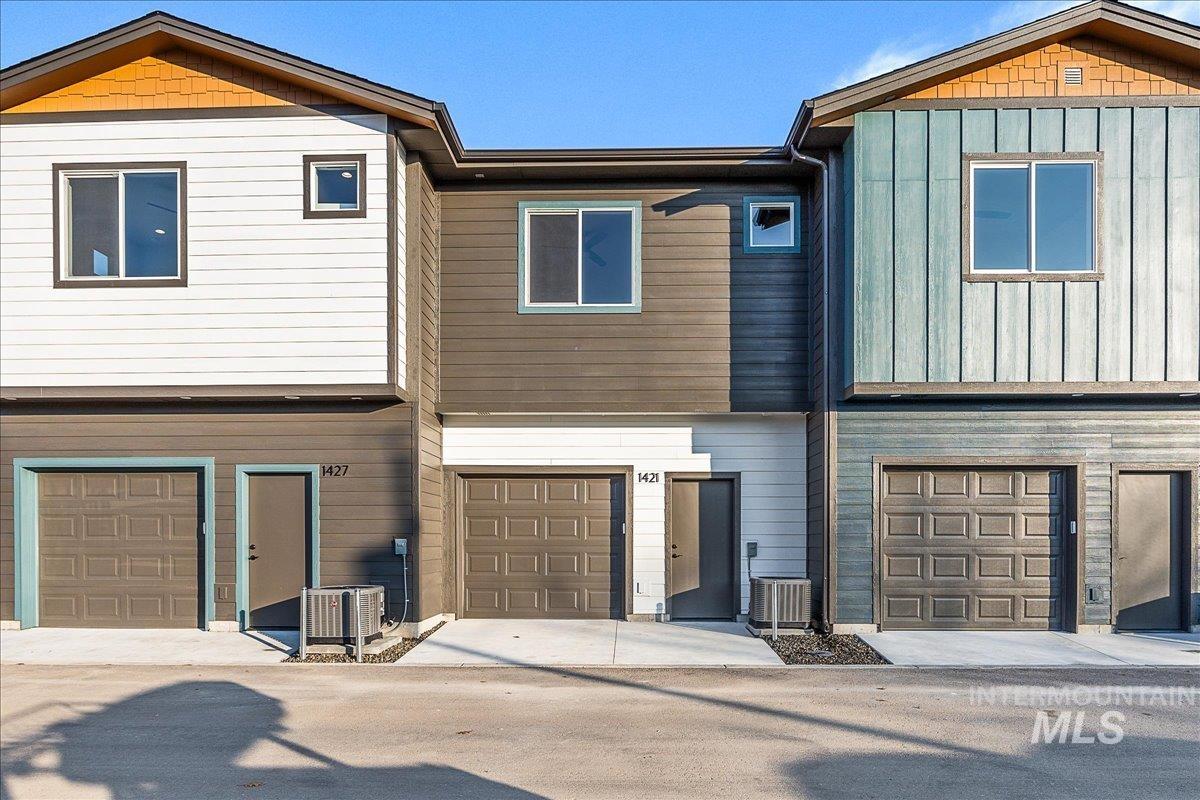Craftsman house with an attached garage and board and batten siding