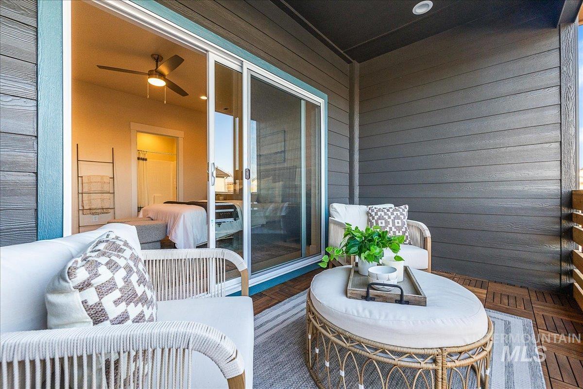 Balcony featuring ceiling fan