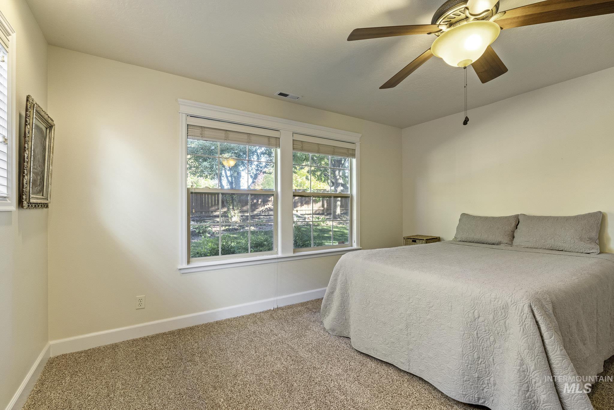 Bedroom featuring carpet floors and a ceiling fan