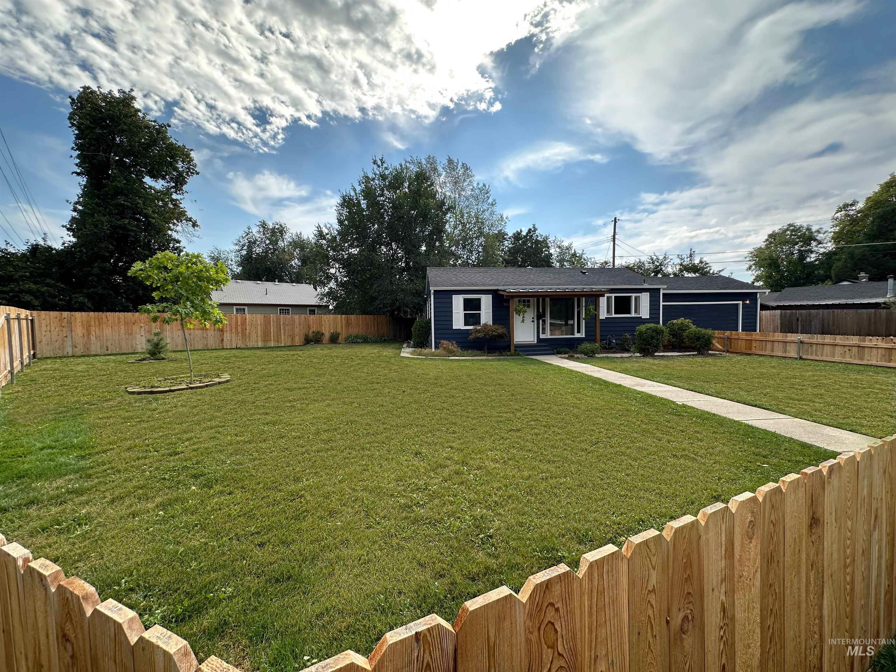 View of front of home featuring a fenced backyard