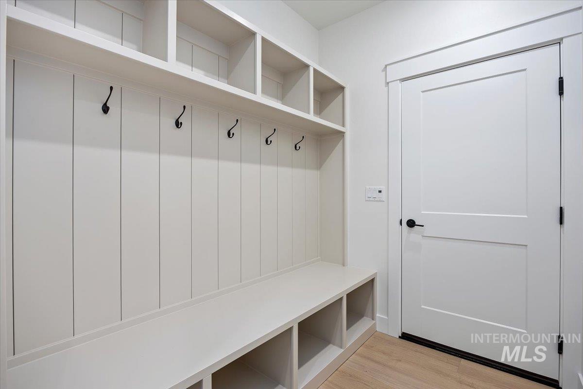 Mudroom with light wood finished floors