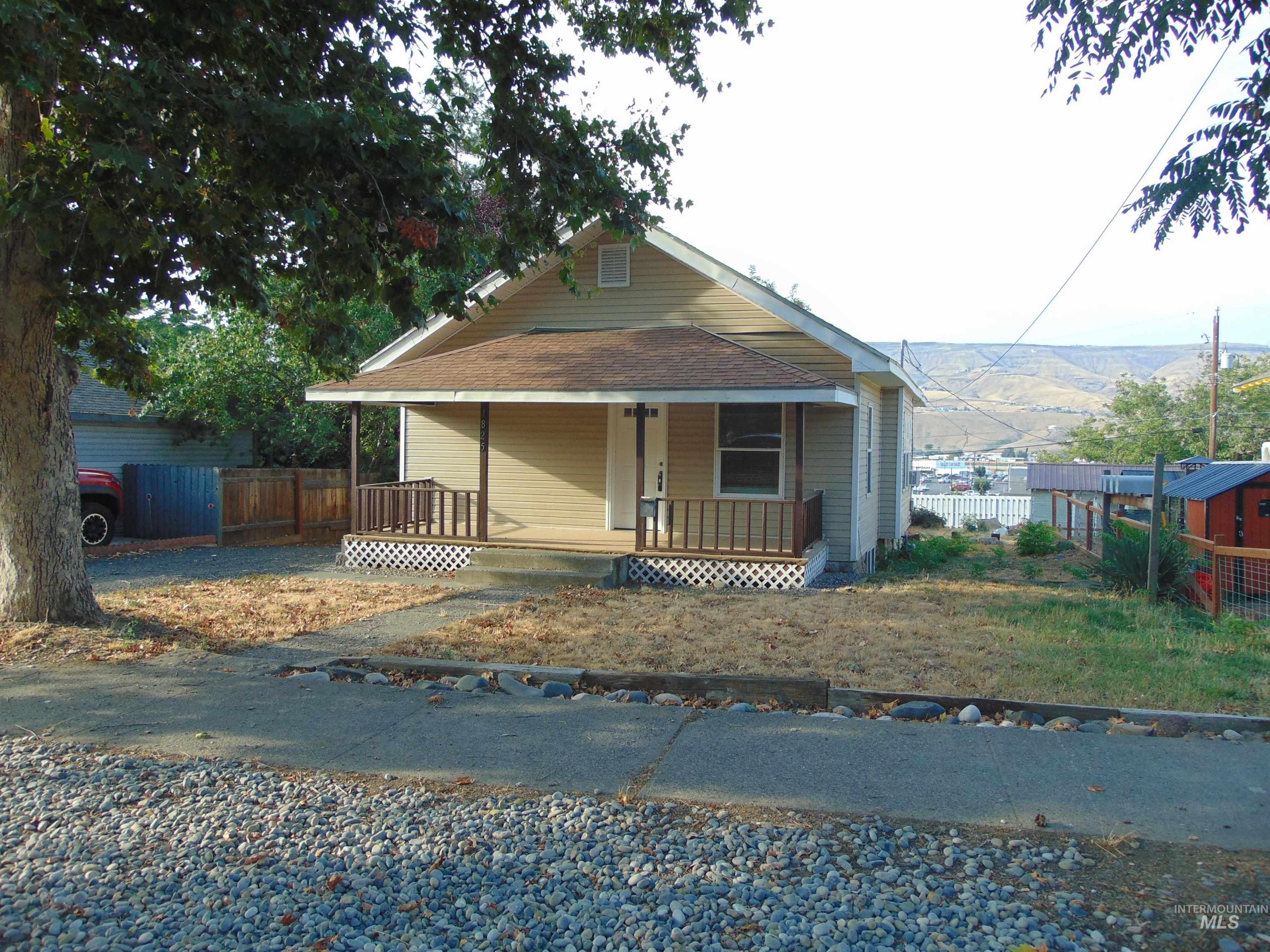 Bungalow-style house with a porch