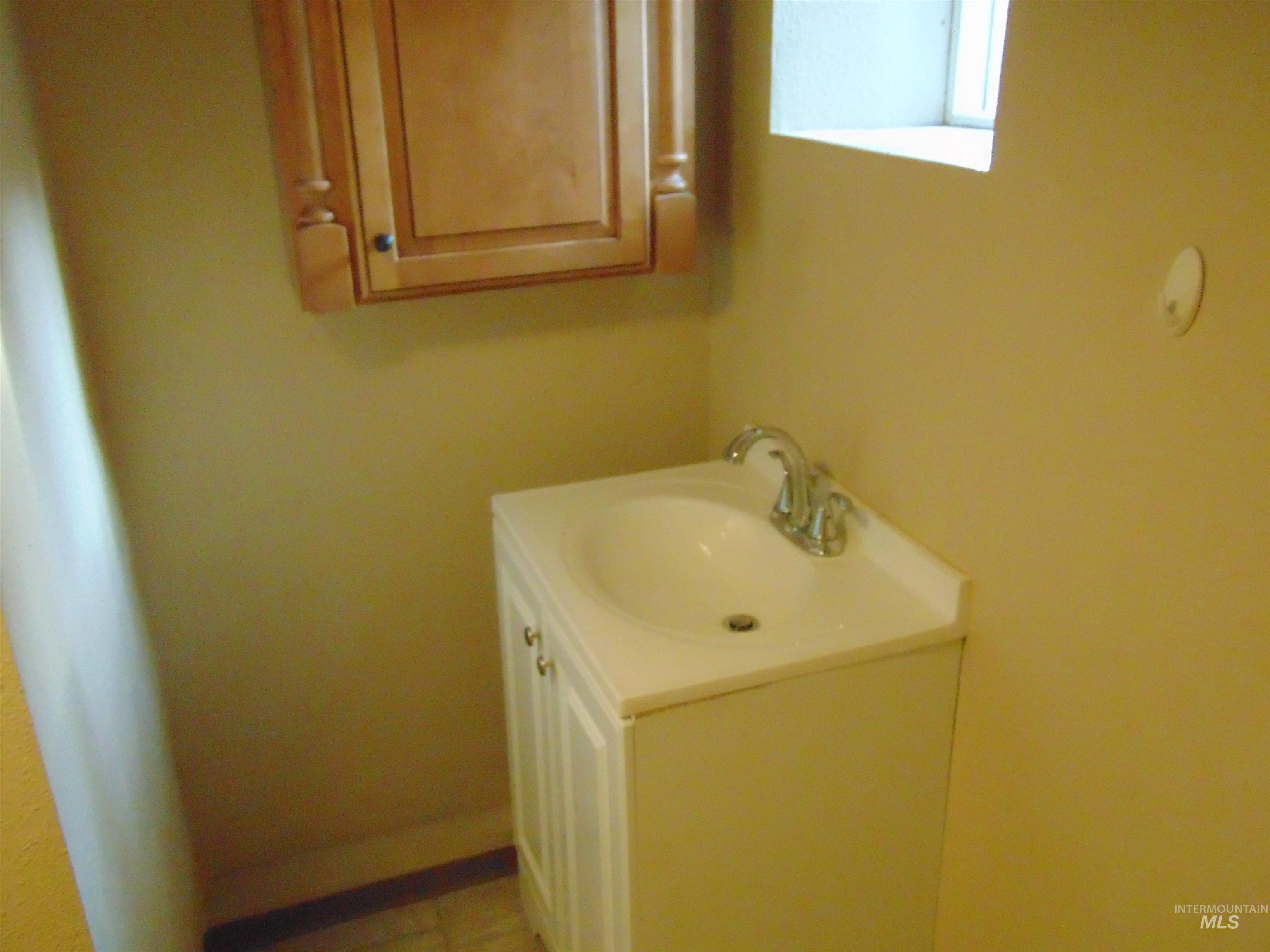 Bathroom with vanity and light tile patterned flooring