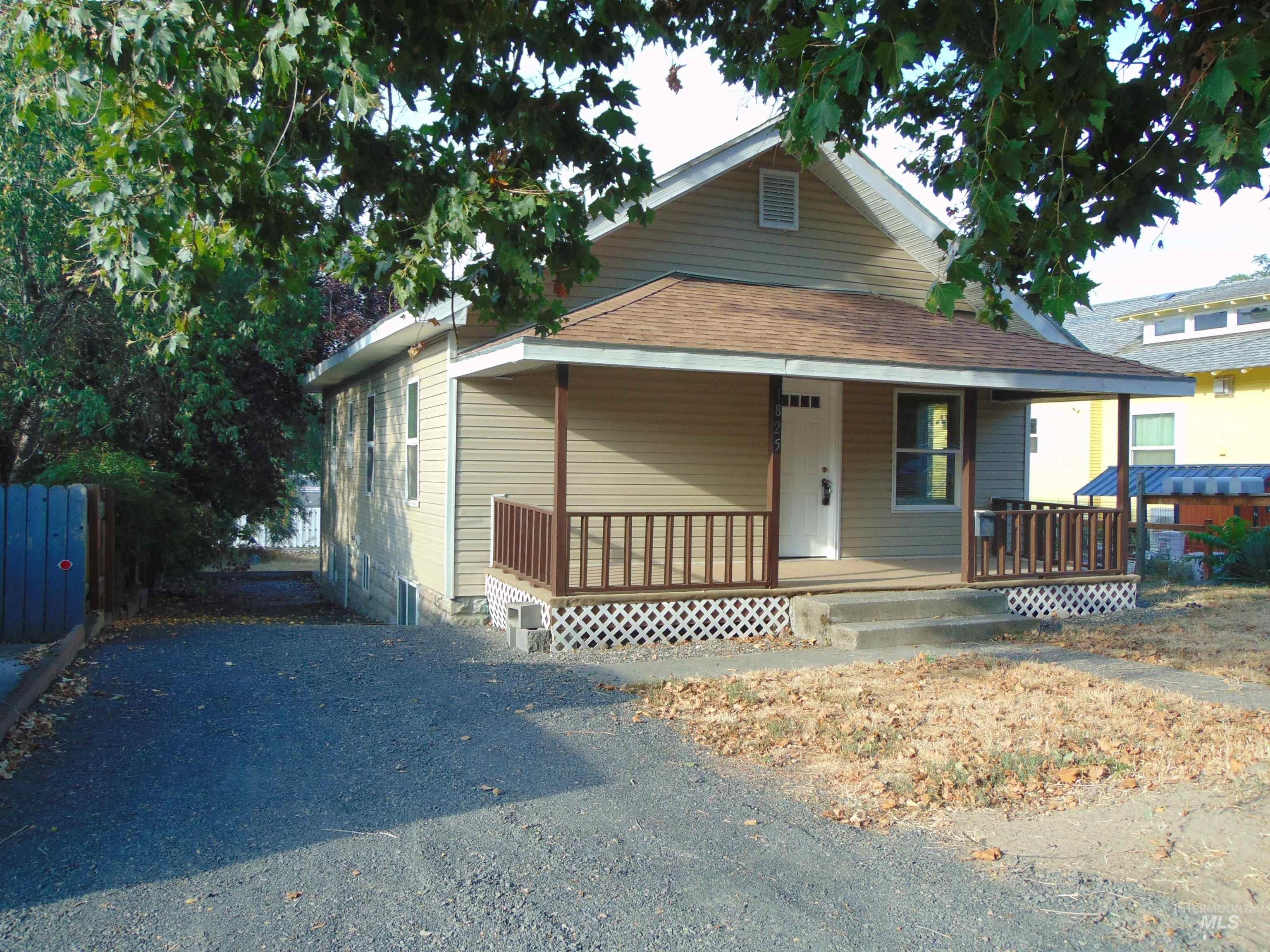 View of front facade featuring a porch and a shingled roof