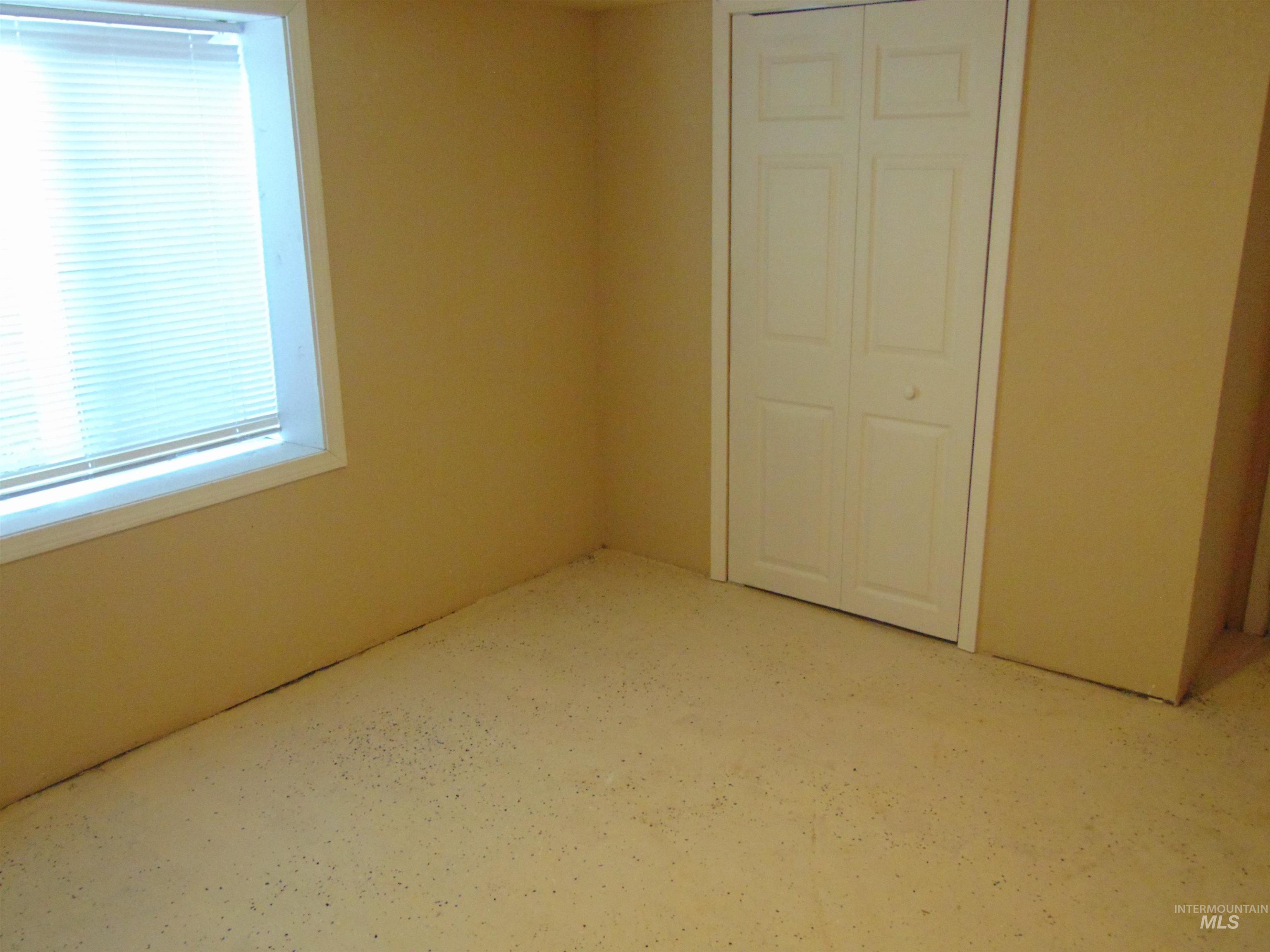 Unfurnished bedroom featuring a closet