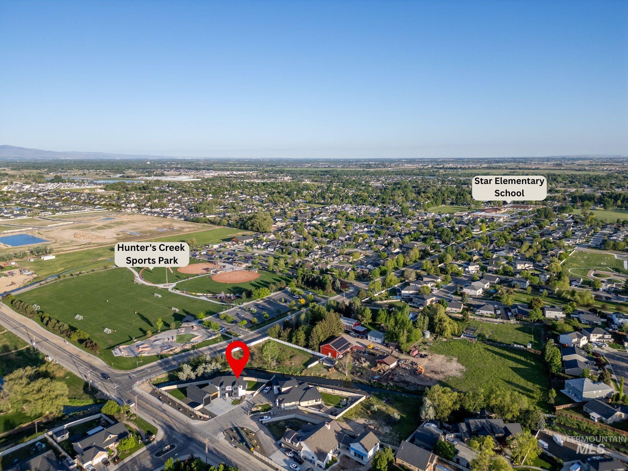 Aerial overview of property's location featuring nearby suburban area