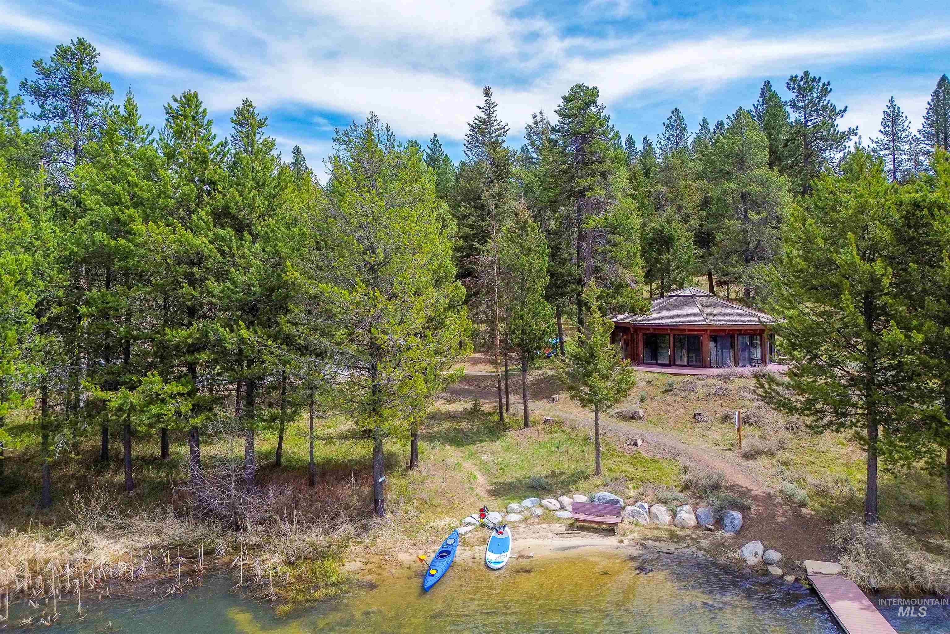 View of subject property featuring a forest