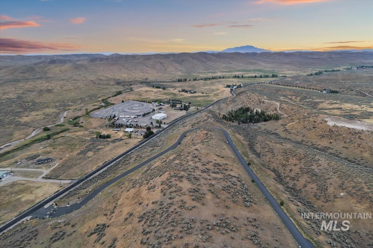 Aerial view at dusk of a mountain view and a view of countryside