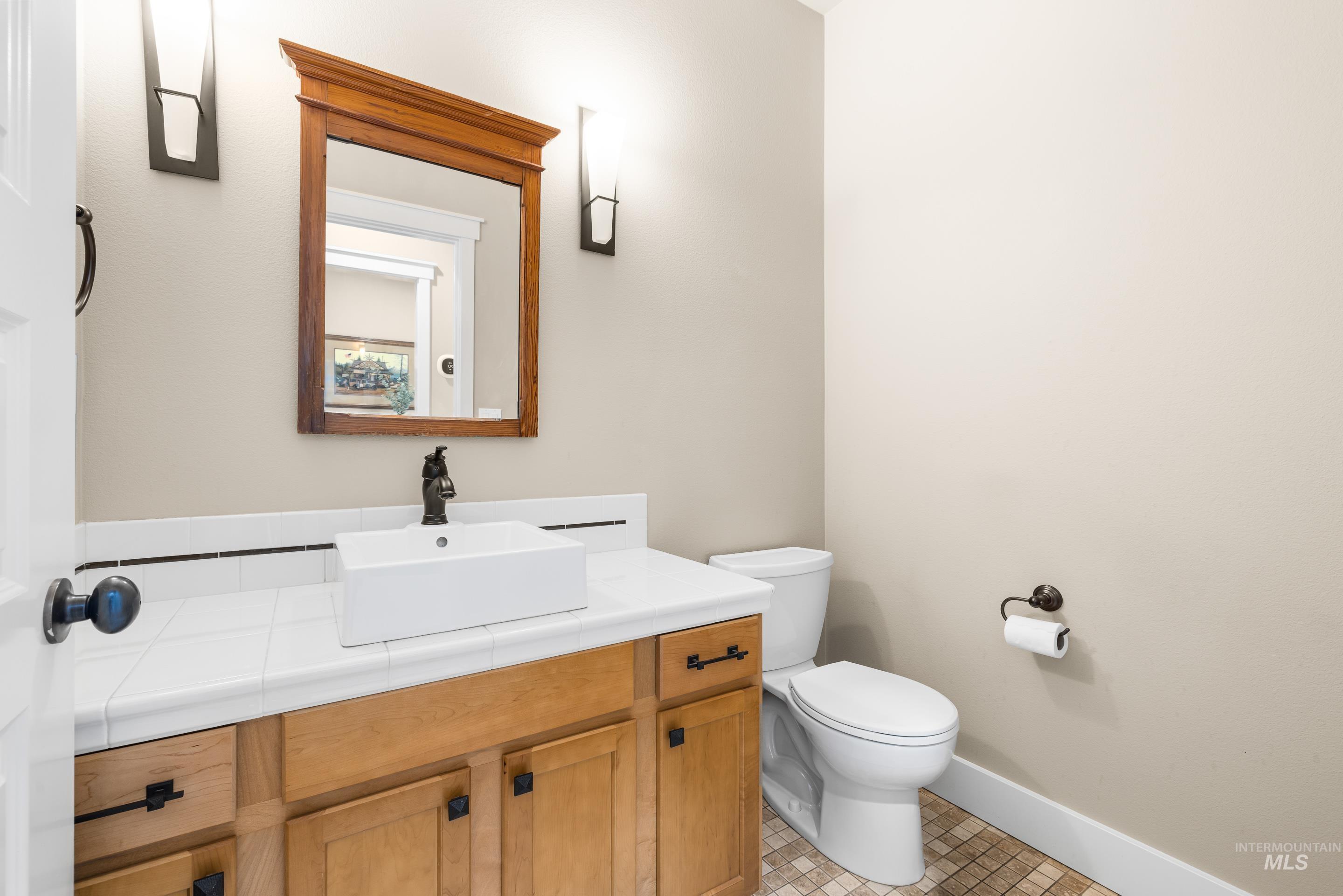 Bathroom featuring vanity and light tile patterned floors