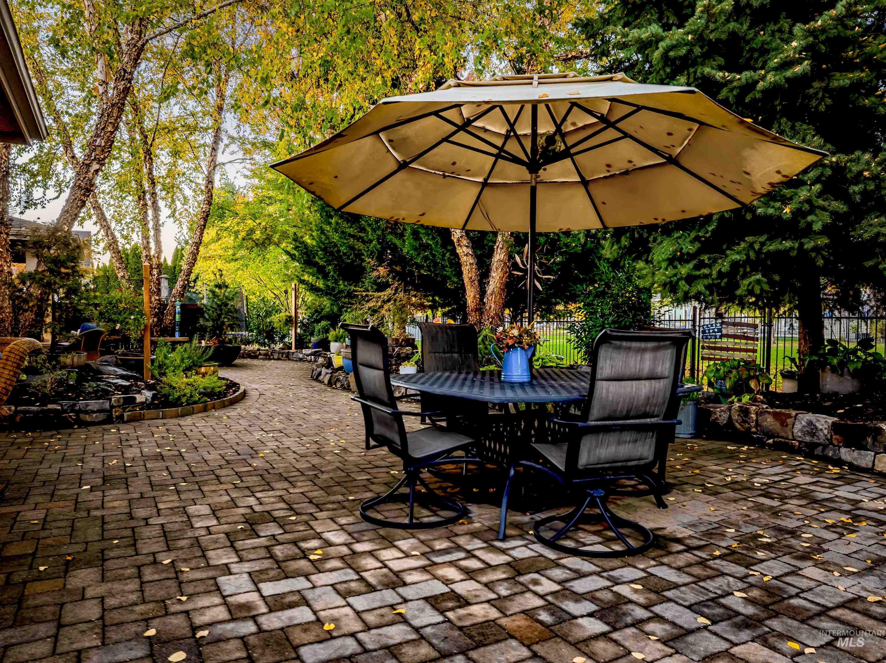 View of patio / terrace with outdoor dining area and view of scattered trees