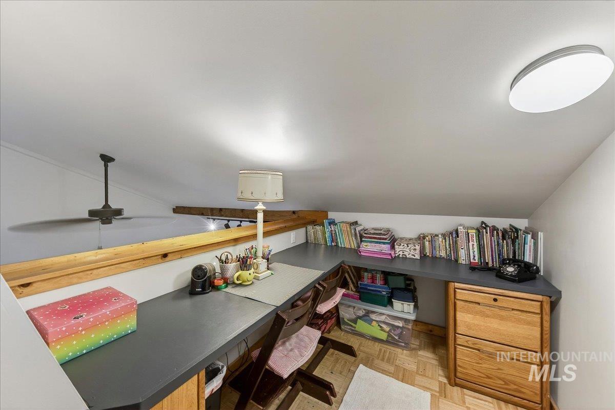 Office space featuring parquet flooring