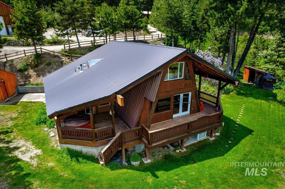Exterior space featuring a metal roof and a deck