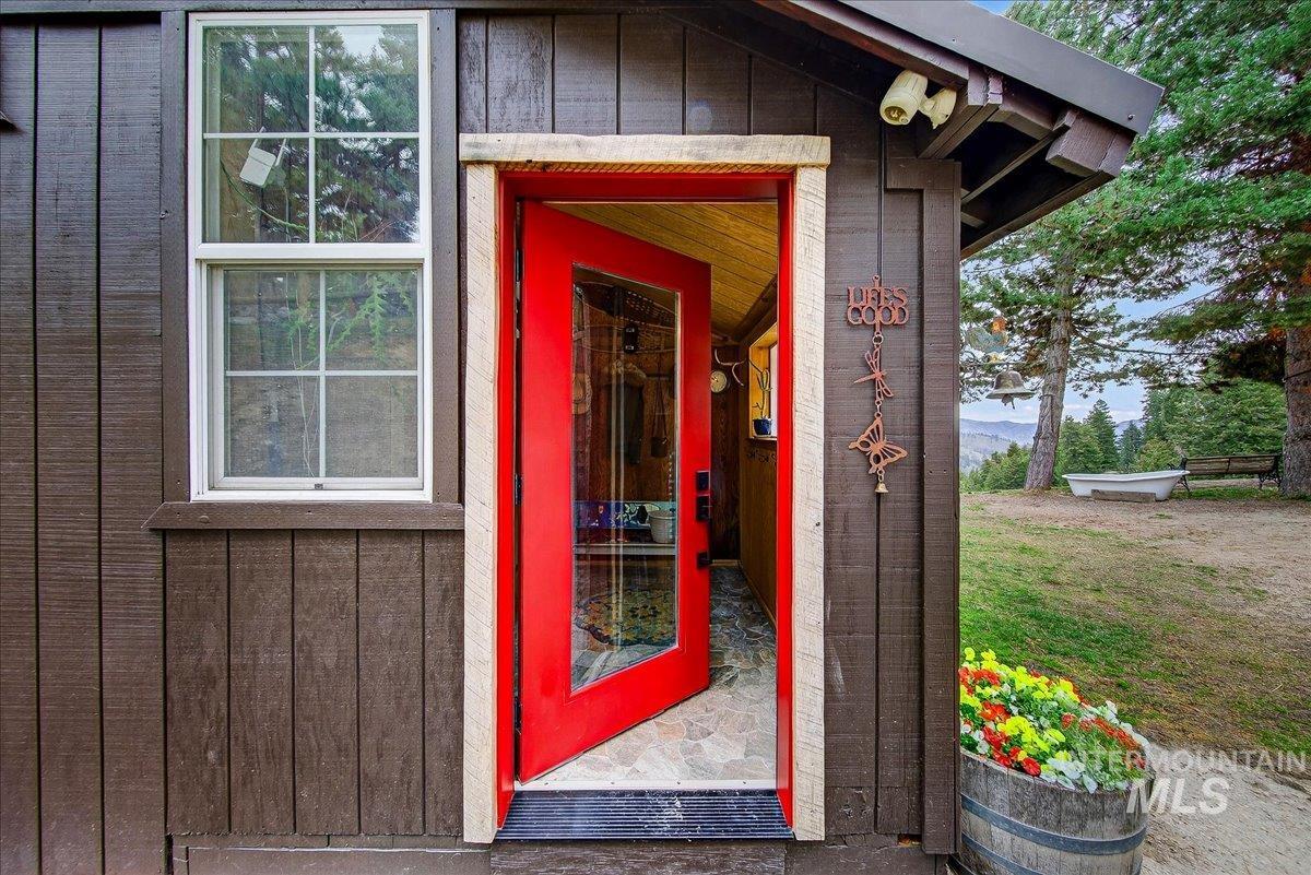 Entrance to property featuring board and batten siding