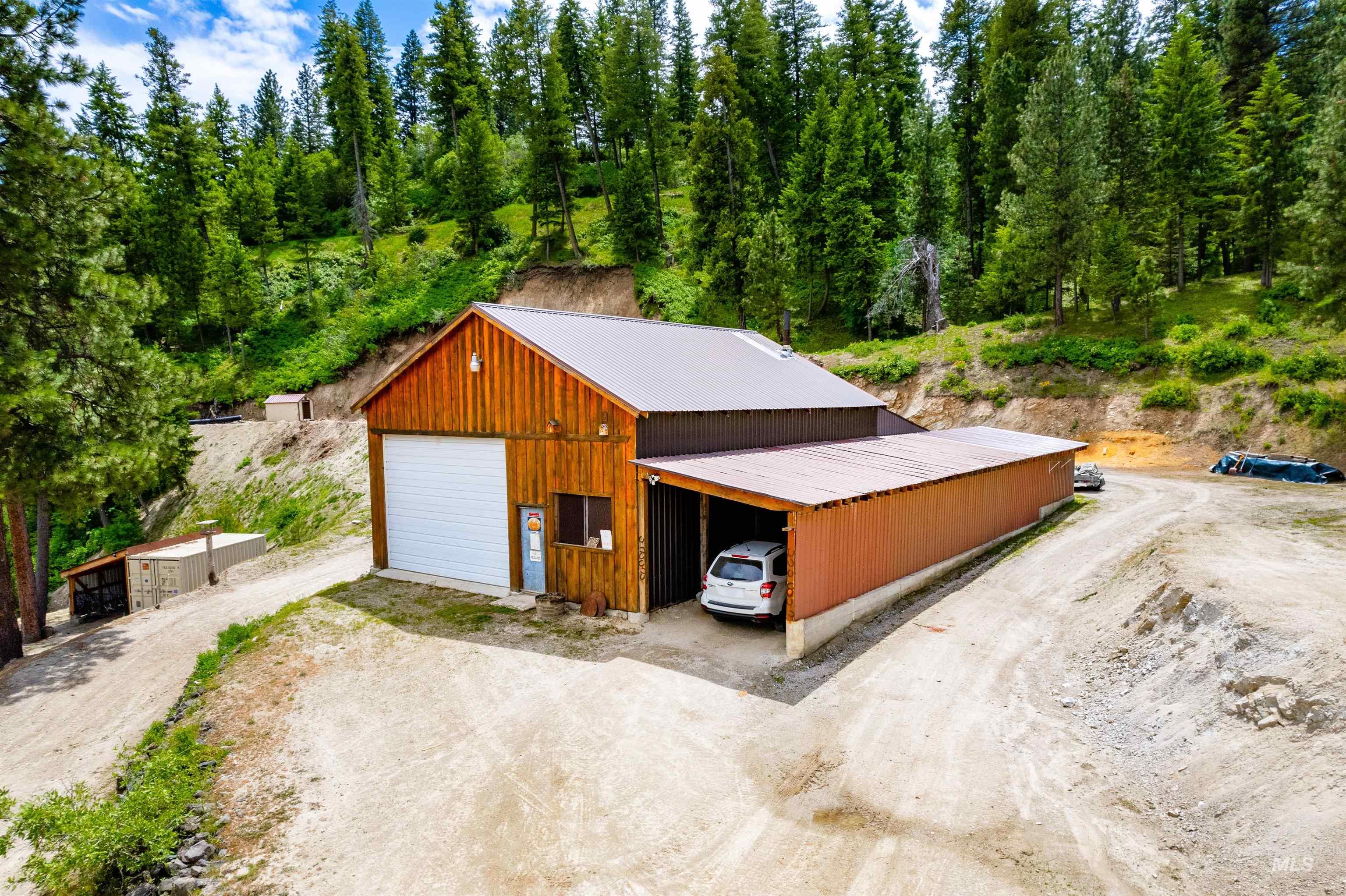 View of outbuilding with driveway
