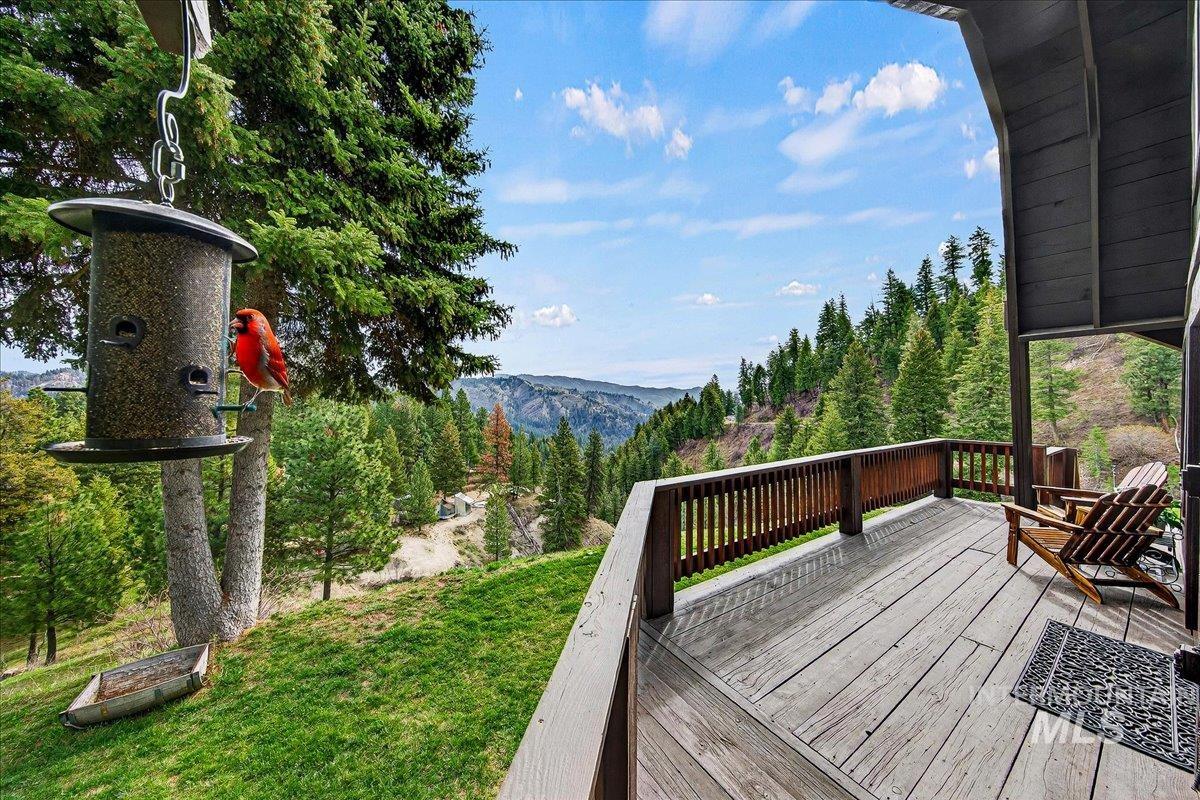Wooden deck featuring a lawn