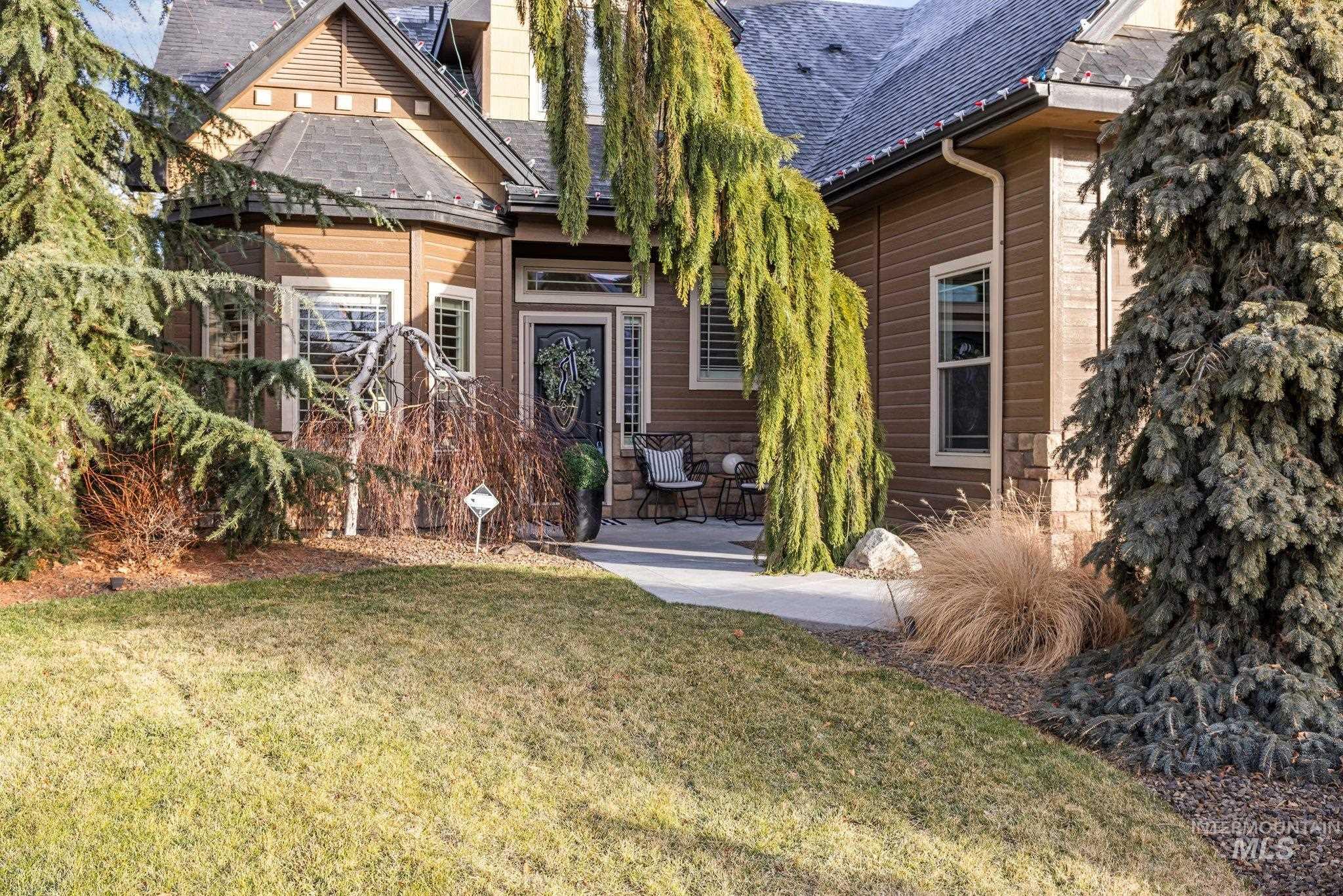 Rear view of property with a patio area, a yard, and roof with shingles