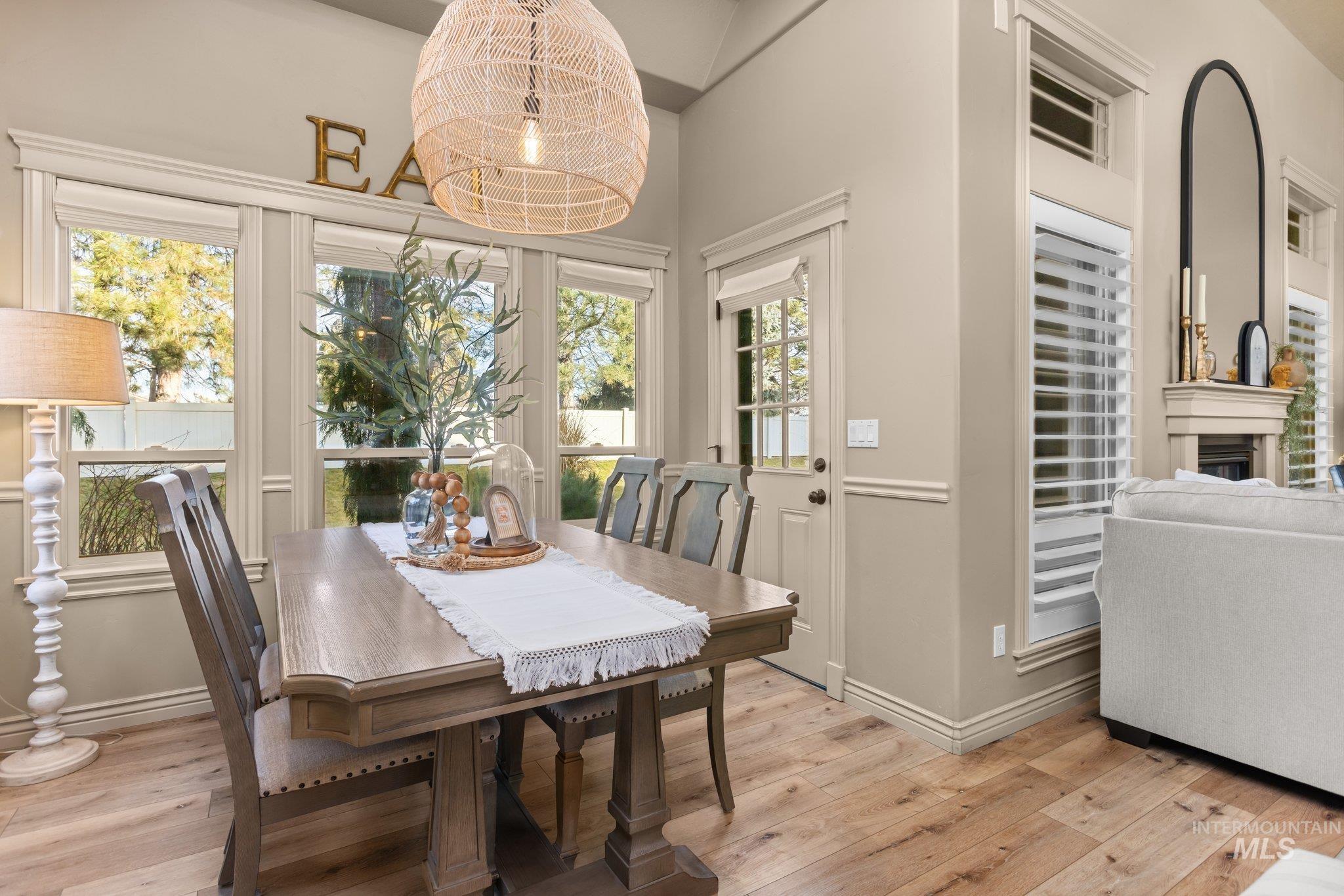 Dining space featuring light wood-style floors and baseboards