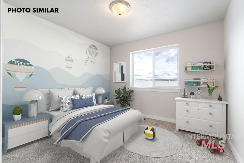 Bedroom featuring baseboards and light carpet