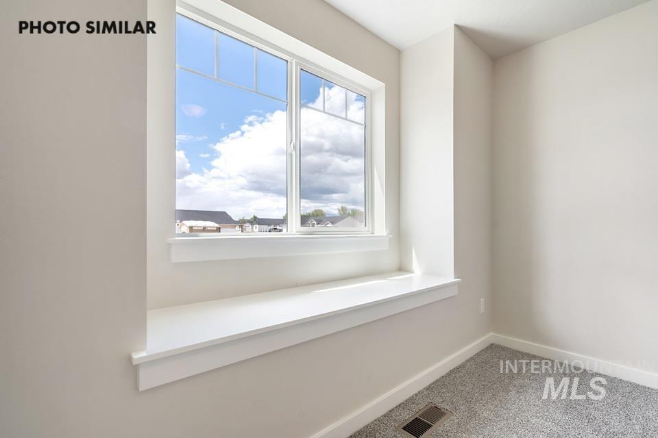 Detailed view of carpet and baseboards